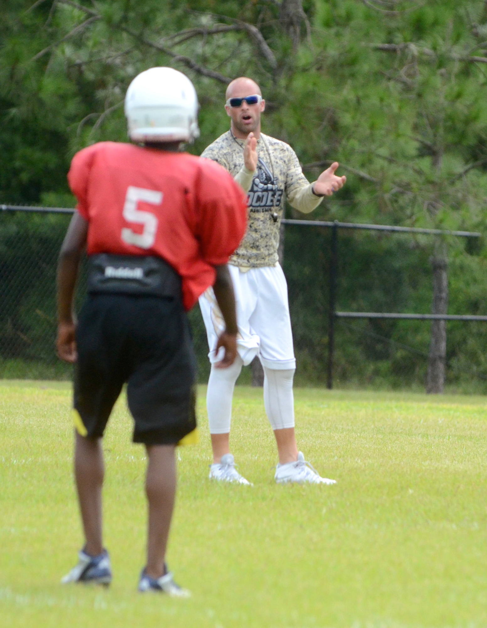 Boltus encourages players at a fall practice in 2015.