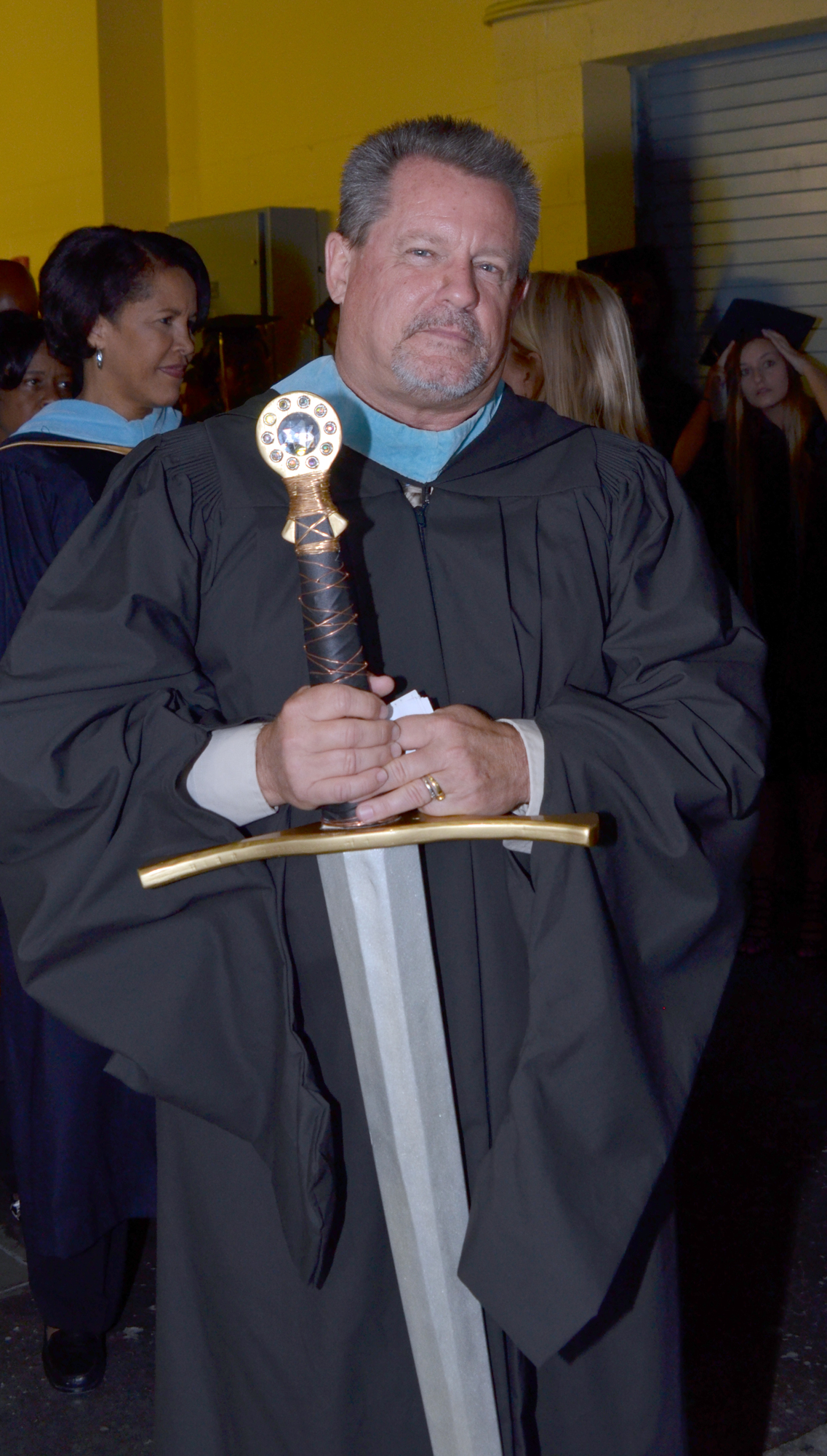 Bill Floyd leads the procession at the start of the 2016 Ocoee High School graduation.