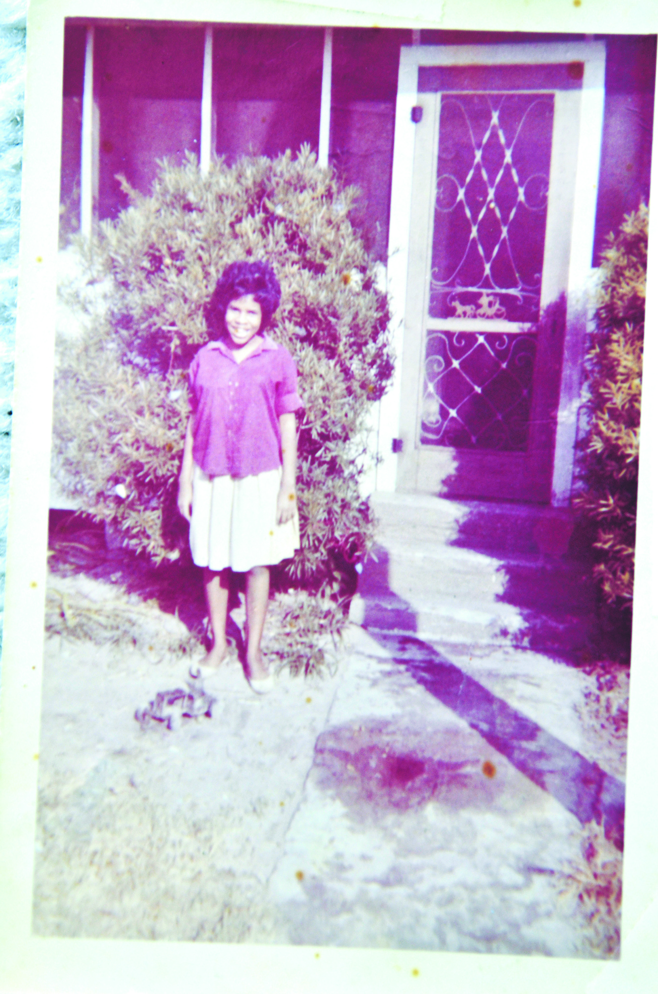 A young Betty Wade stands in front of her home on what is now Gulley Avenue.