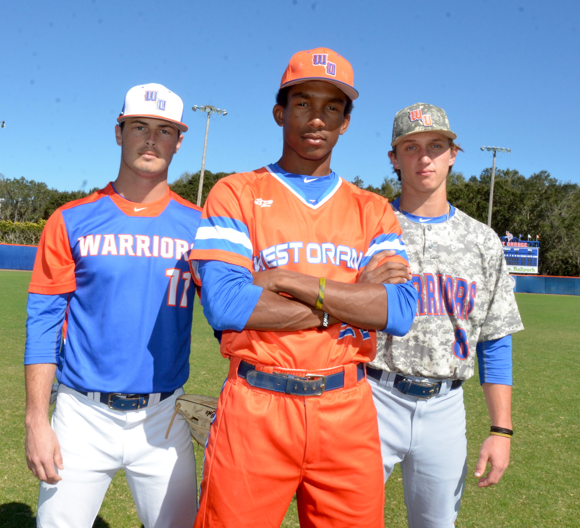 Hunter Cole, left, Justin Holmes and Doug Nikhazy show off some of the team's alternate uniforms.