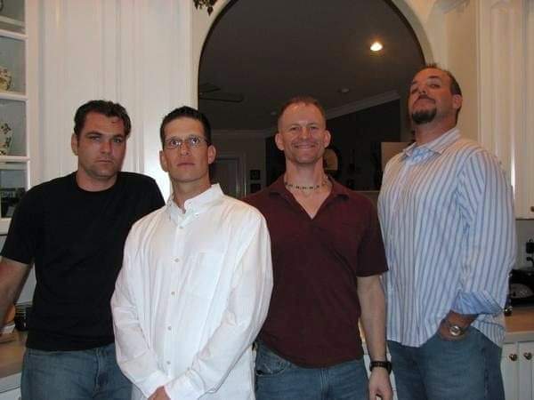 Childhood buddies Aaron Stogsdill, left, Michael Holseth, Mark Allen and Keith Packey caught up during a gathering two years ago. Keith said he is on his toes because he and Mark always tried to be the tallest in the photo.