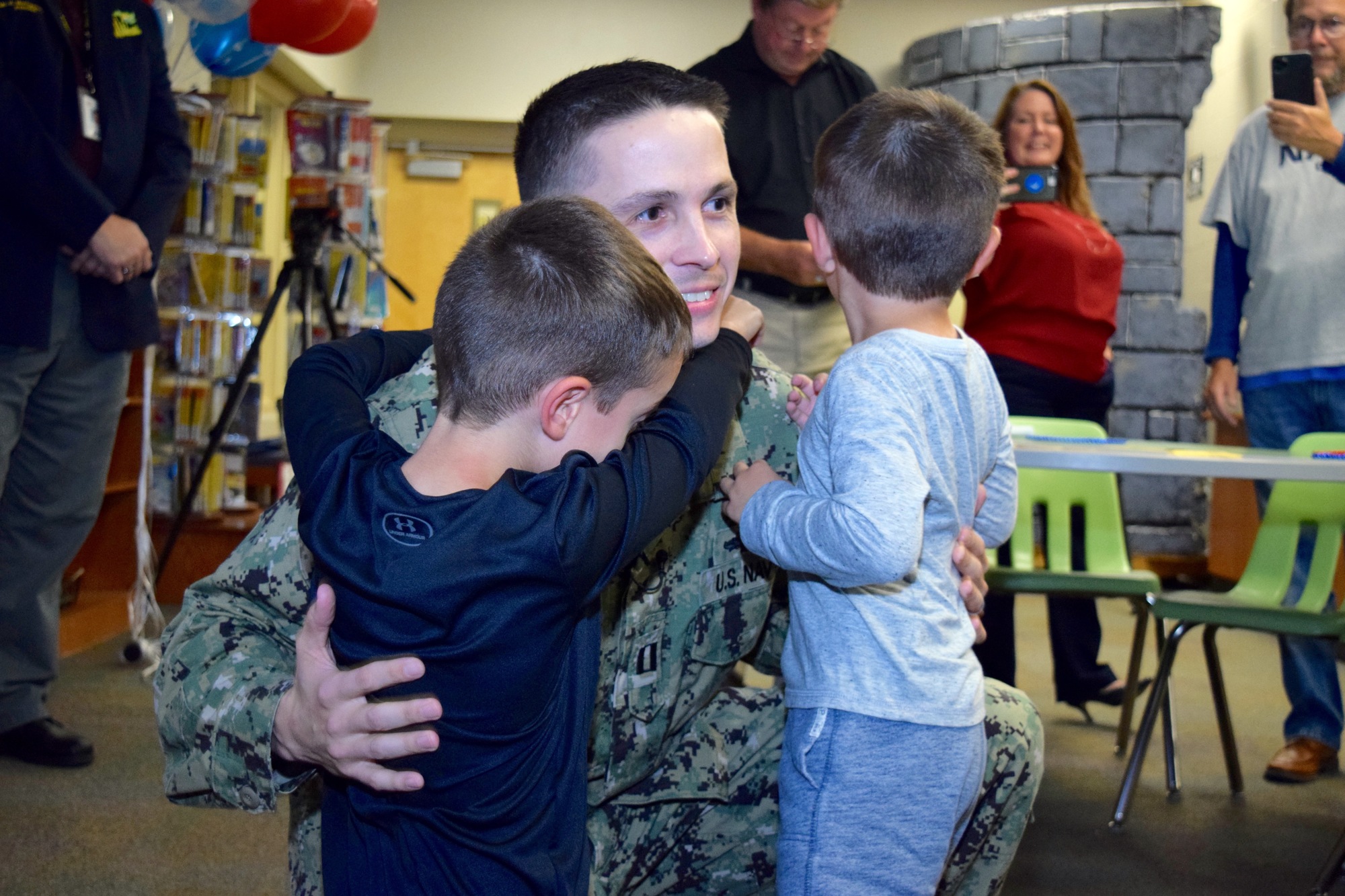 Lt. Steve Phillips’ sons, Jack and Chase, were thrilled to have him home again.