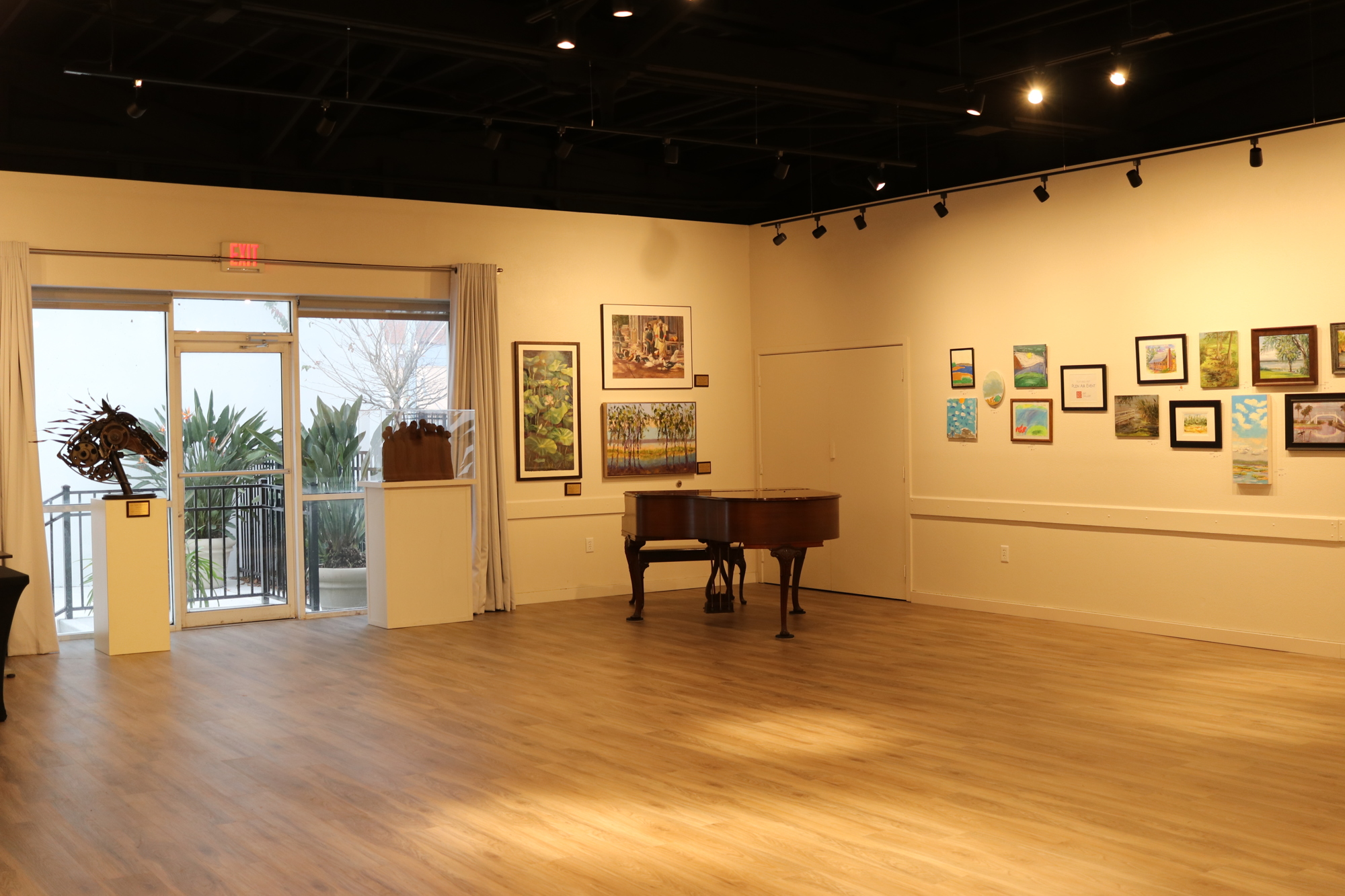 Improvements to the back room of the gallery include raising the ceiling, and installing new flooring and lighting.