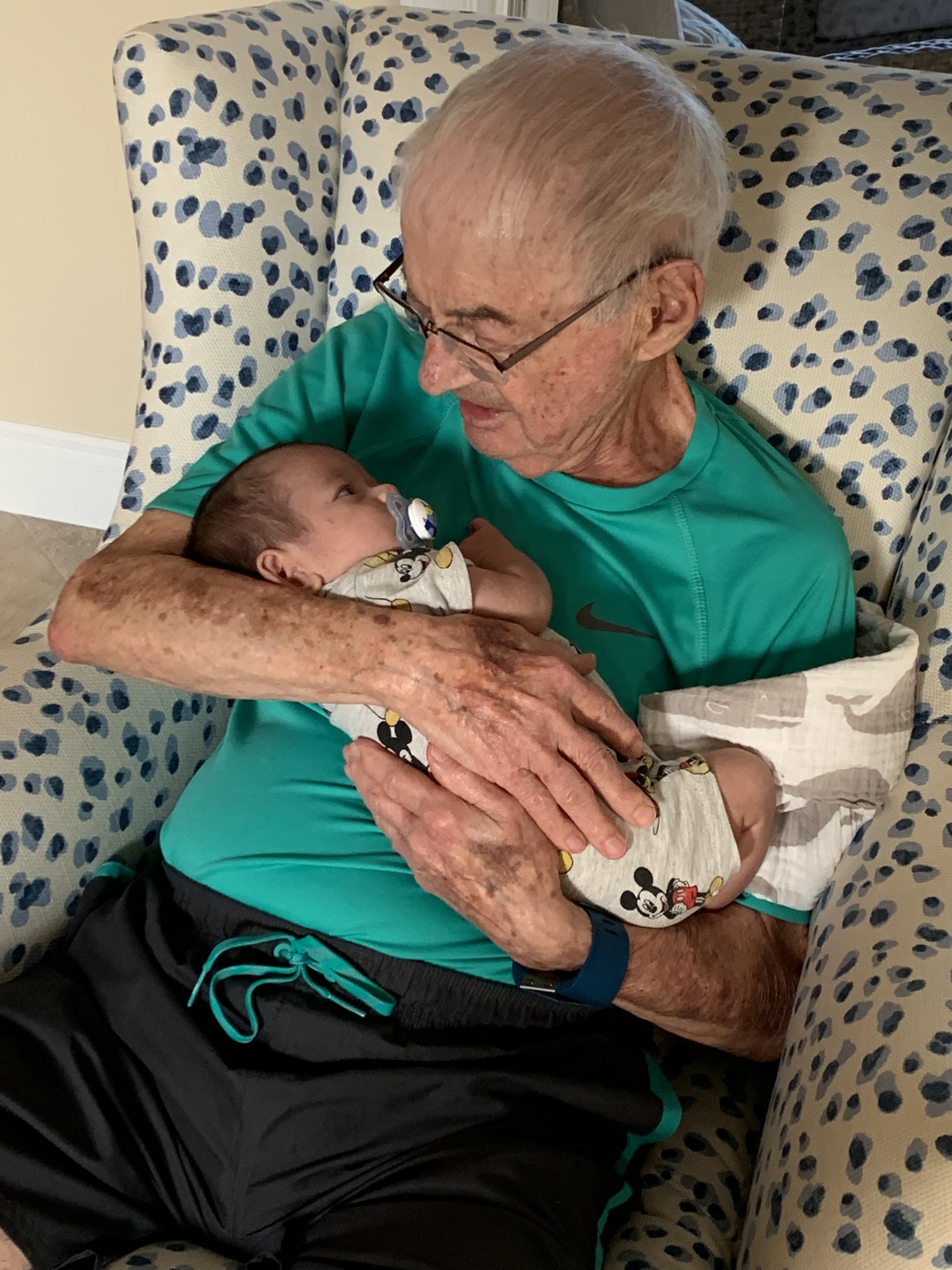Alfred “Poppy” Bracciano holds Angel and Haim’s son, Niko, shortly after he was born. Alfred died in summer 2019.