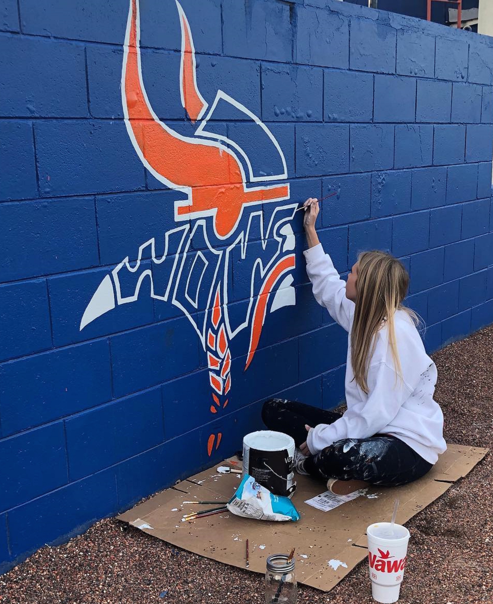 Emma Lewandowski spent about a week during the holiday break to paint the new mural at the West Orange High baseball field.