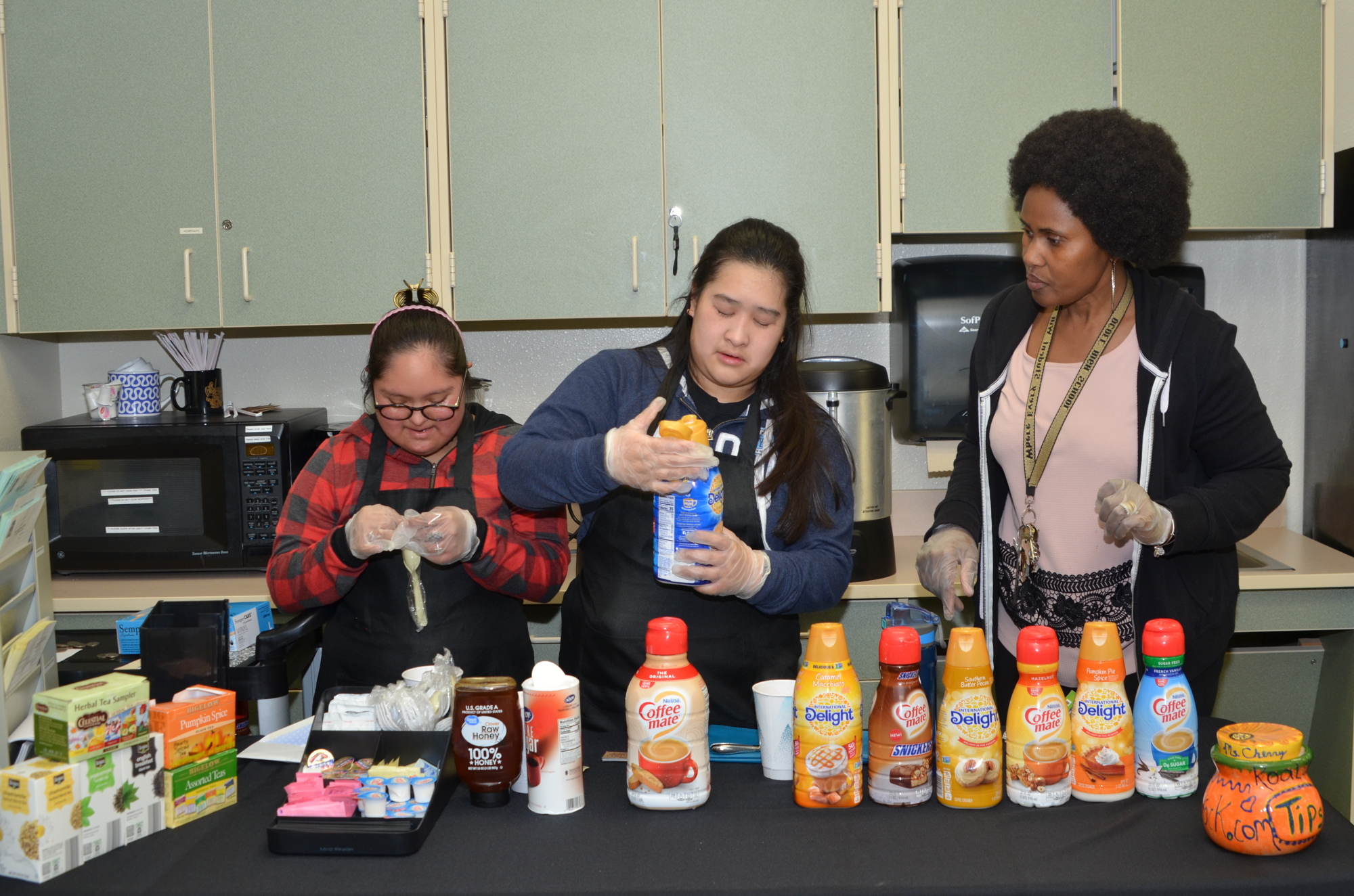 Natalia Barriga-Sanchez, left, with Elizabeth Nguyen, is one of the 10 students who operate the Jump Start Café! at Ocoee High School. Their teacher, Olajumoke Adebimpe, manages the project.