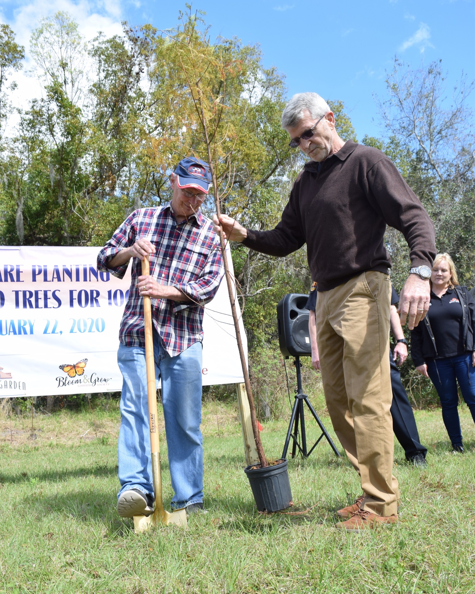 Winter Garden Mayor John Rees and City Manager Mike Bollhoefer helped plant the 1,000th tree.