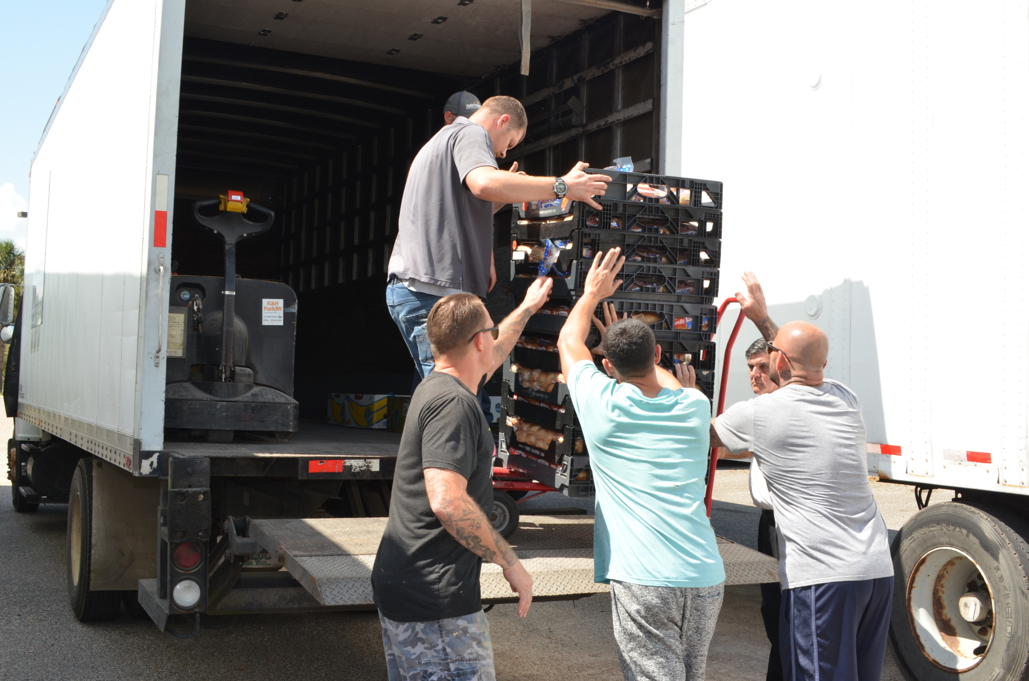 Volunteers unloaded semi tractor-trailers full of donations.