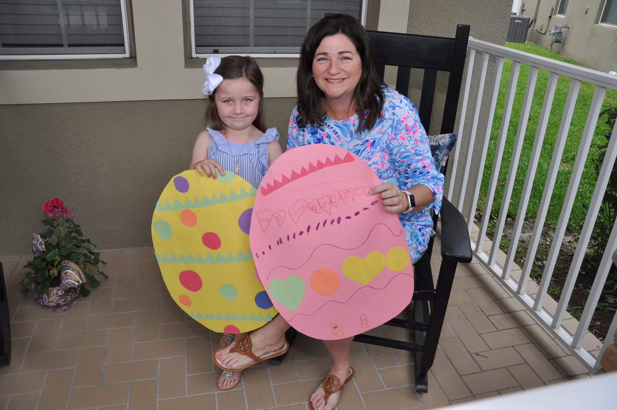 Harper, 5, and Laura Cobb plan to make Easter special from home by hanging eggs in their front windows.