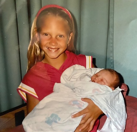 Erin Strange, then 8, beamed as she held her new cousin, Chad Cross.