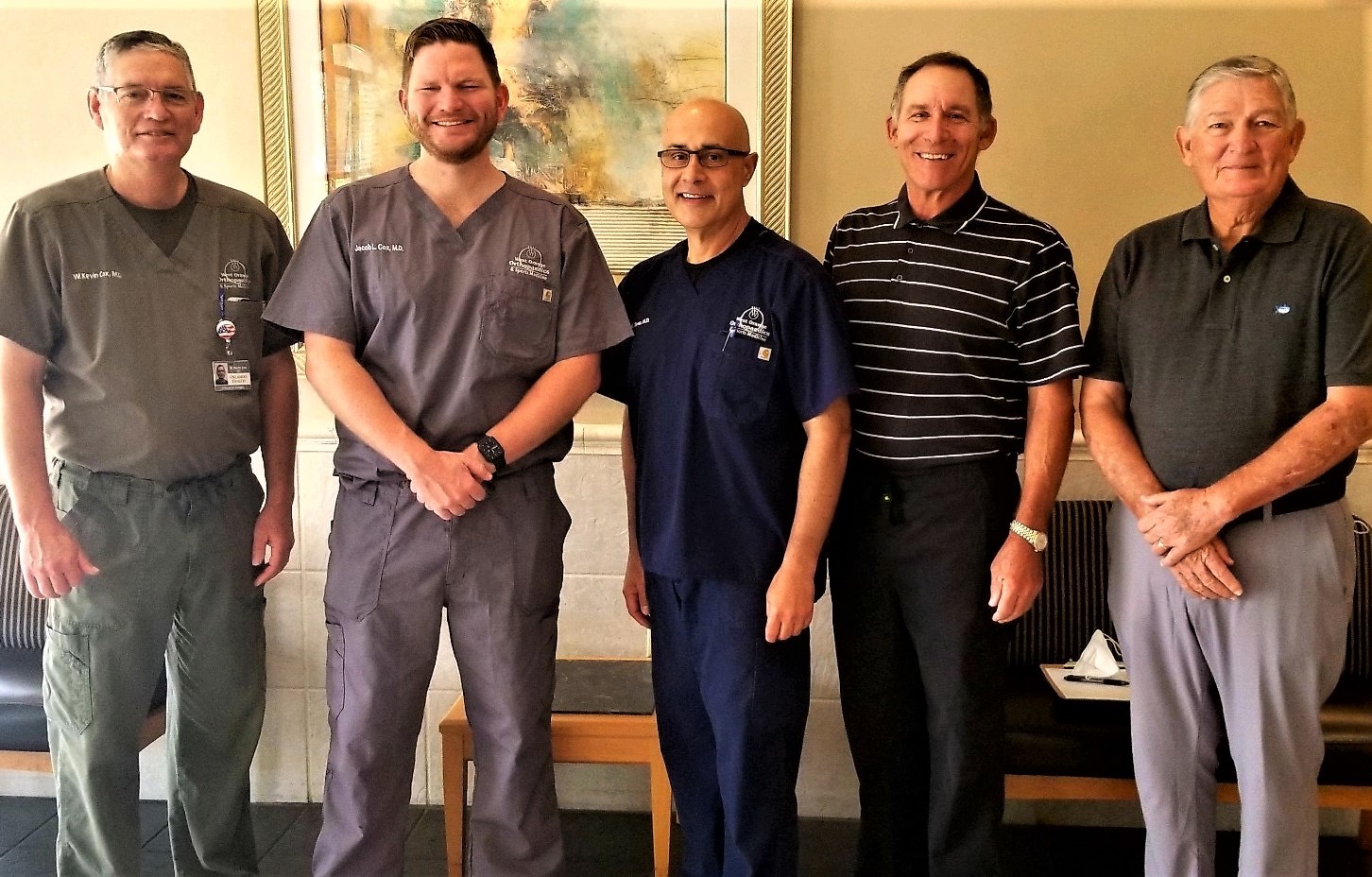 Doctors W. Kevin Cox, left, Jacob Cox, Jose Torres and Paul Maluso are the orthopedic team at the practice. At right is retired Dr. William Cox.