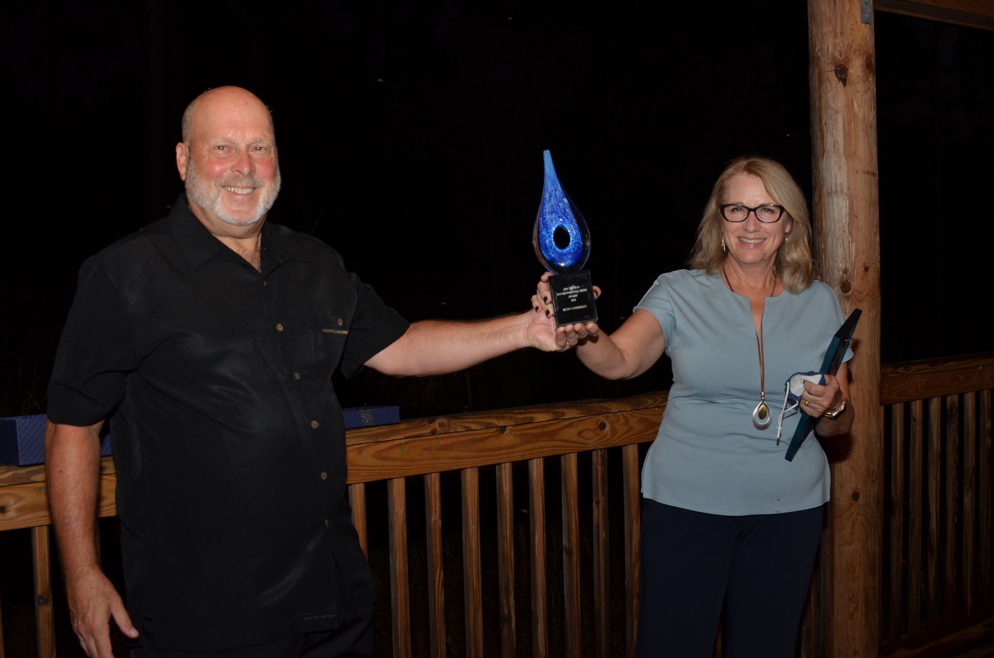 Orange County Commissioner Betsy VanderLey accepted the Jim Thomas Environmental Hero Award from Joe Dunn, immediate past president of Friends of Lake Apopka.
