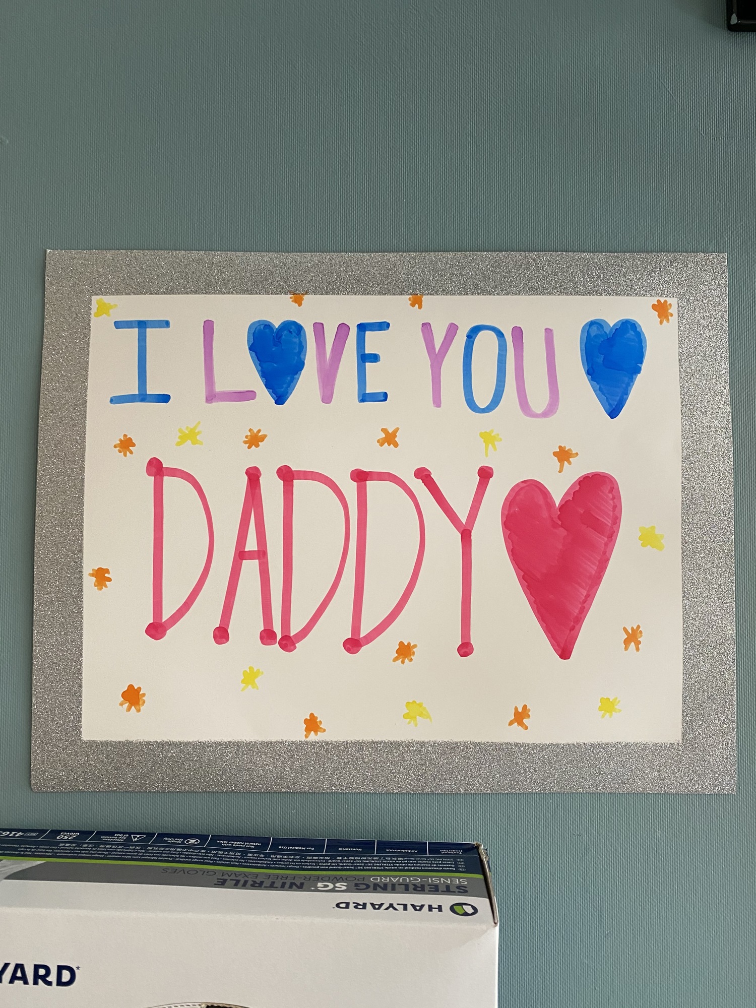 A sign from Joel Sioson’s children hung in his hospital room.