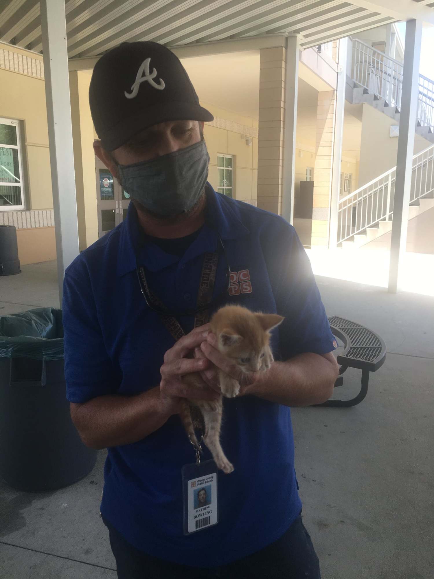 OCPS employee Lance Bowling with Knight the kitten. (Courtesy)