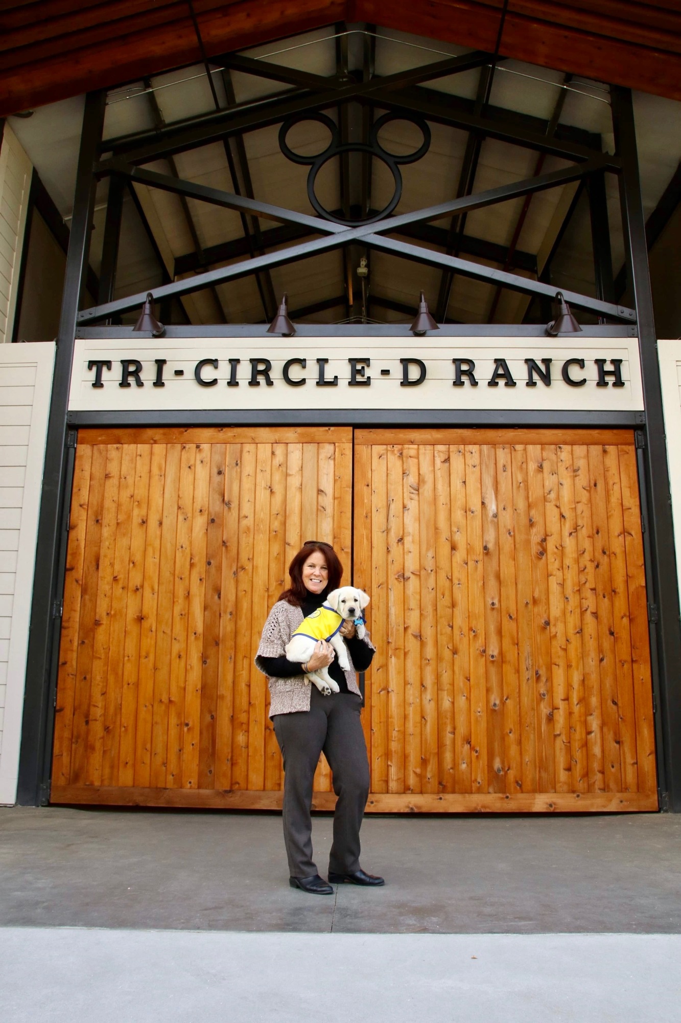 With Robin Walker serving as the manager of the Tri-Circle-D Ranch at Walt Disney Walt Resort, her Canine Companions for Independence puppy, Walt, sometimes gets to come to work with her. (Courtesy CCI)