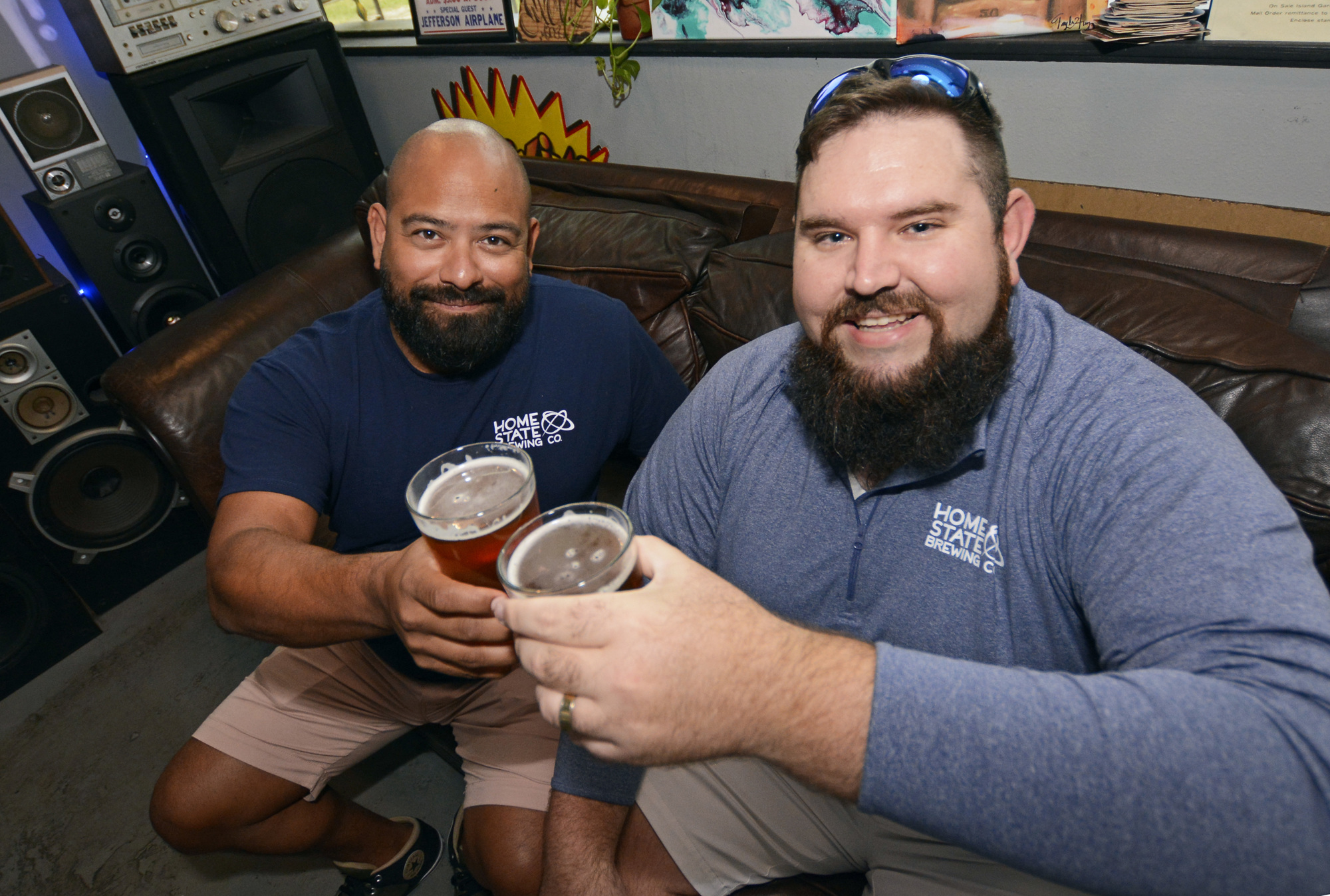 Home State Brewing Co. co-owners Marco Reyna and Colin Vanatta toast the future of the business. I photo by Jim Carchidi