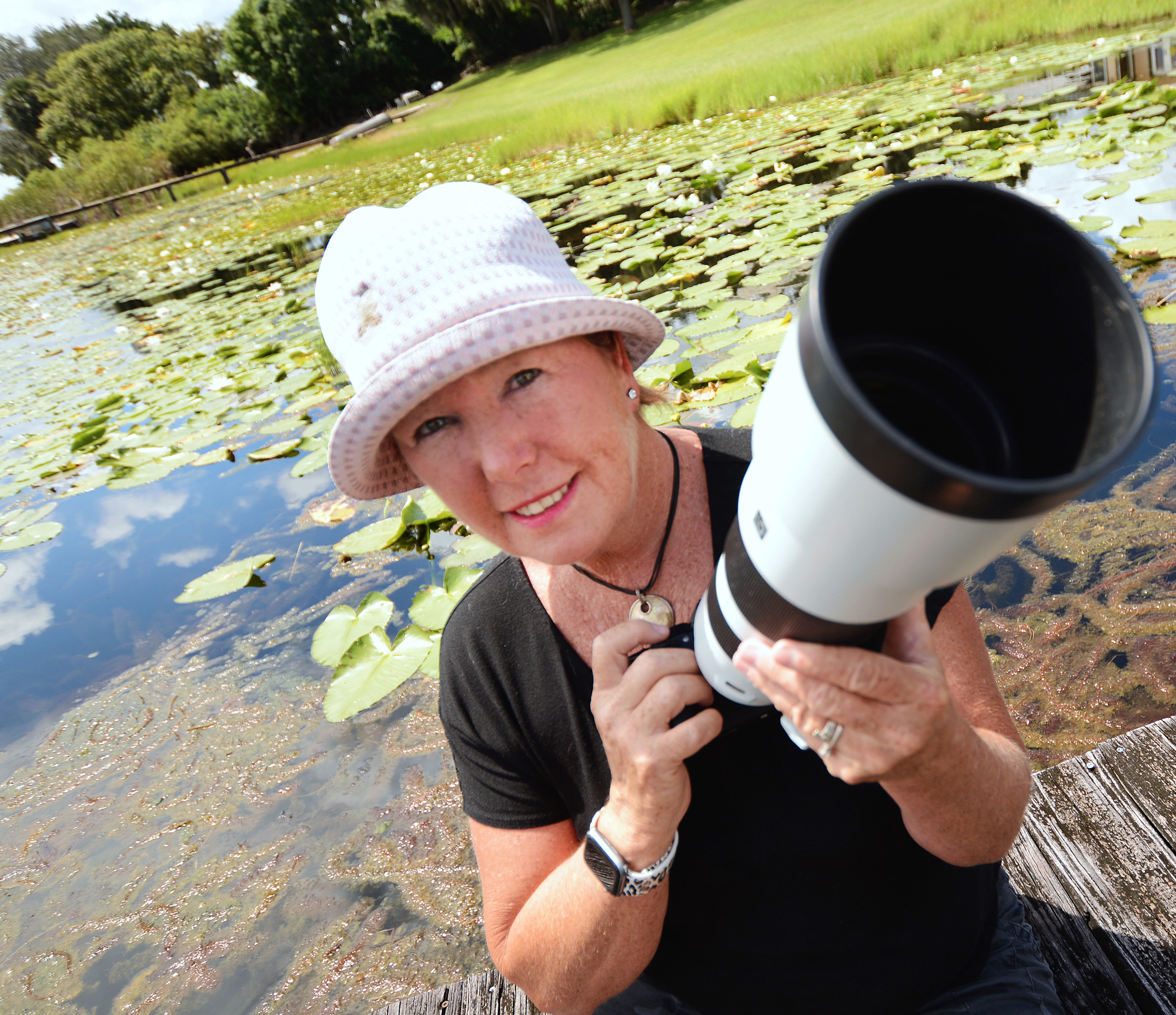 Robin Ulery takes many of her photos from the dock behind her Johns Lake home. I photo by Jim Carchidi