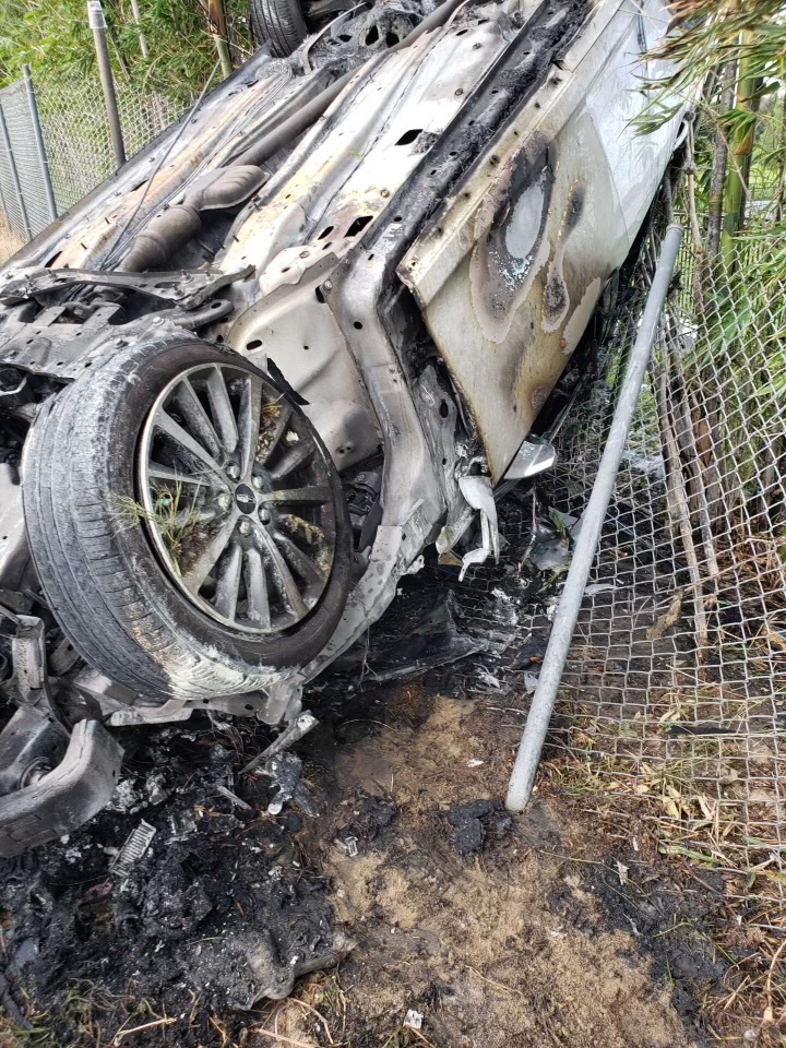 Richard Broccolo’s car landed upside down against a chain-link fence.