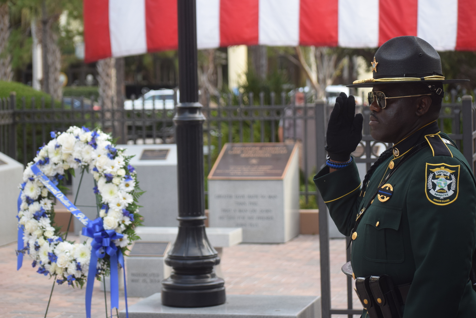 Manatee County Det. Darryl Davis salutes the 10 Manatee County law enforcement officers who were killed in the line of duty.