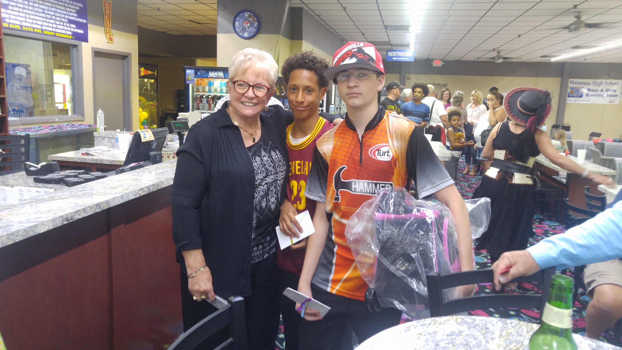 Kay Coffey of St. Augustine, Isaiah Bastista of Jacksonville and grand prize winner, 16-year-old Wesley Outman of St. John's Technical High School in St. Augustine.  Photo courtesy of Palm Coast Yacht Club