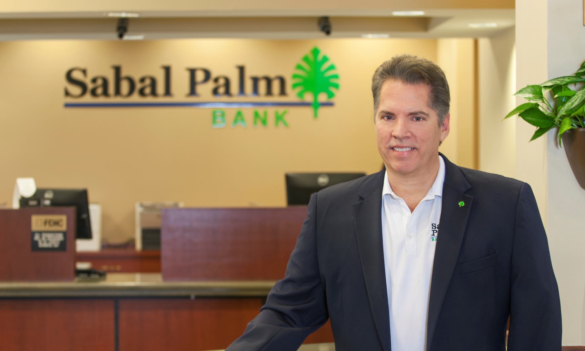 Courtesy. Neil McCurry Jr., president and CEO of Sarasota-based Sabal Palm Bank, says now virtual conversations with customers are the norm, and the bank has partially converted an office to a virtual conference room.