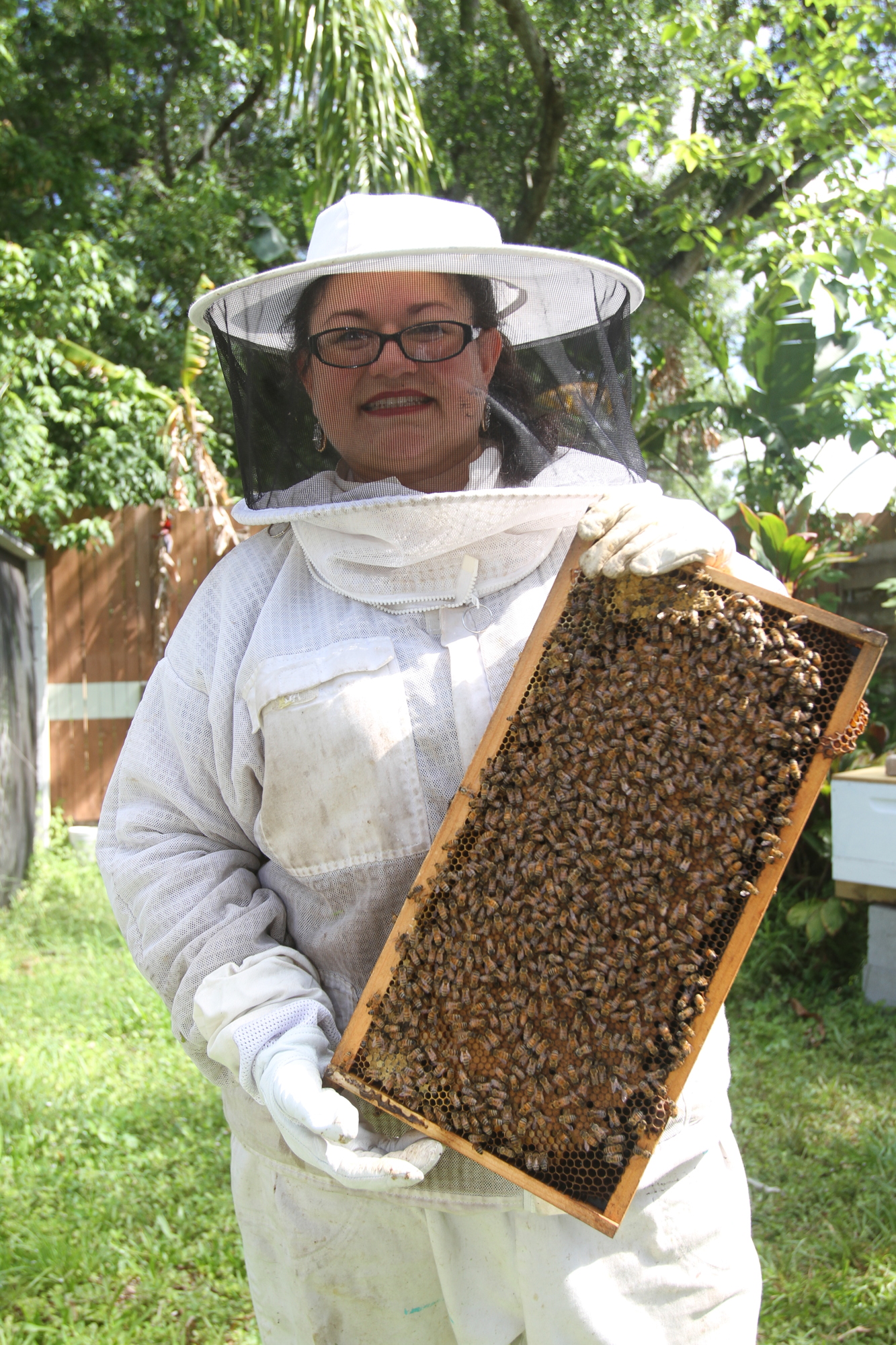 MAY:  Alma Johnson inspects her queen bees around once a week to see how they're progressing.