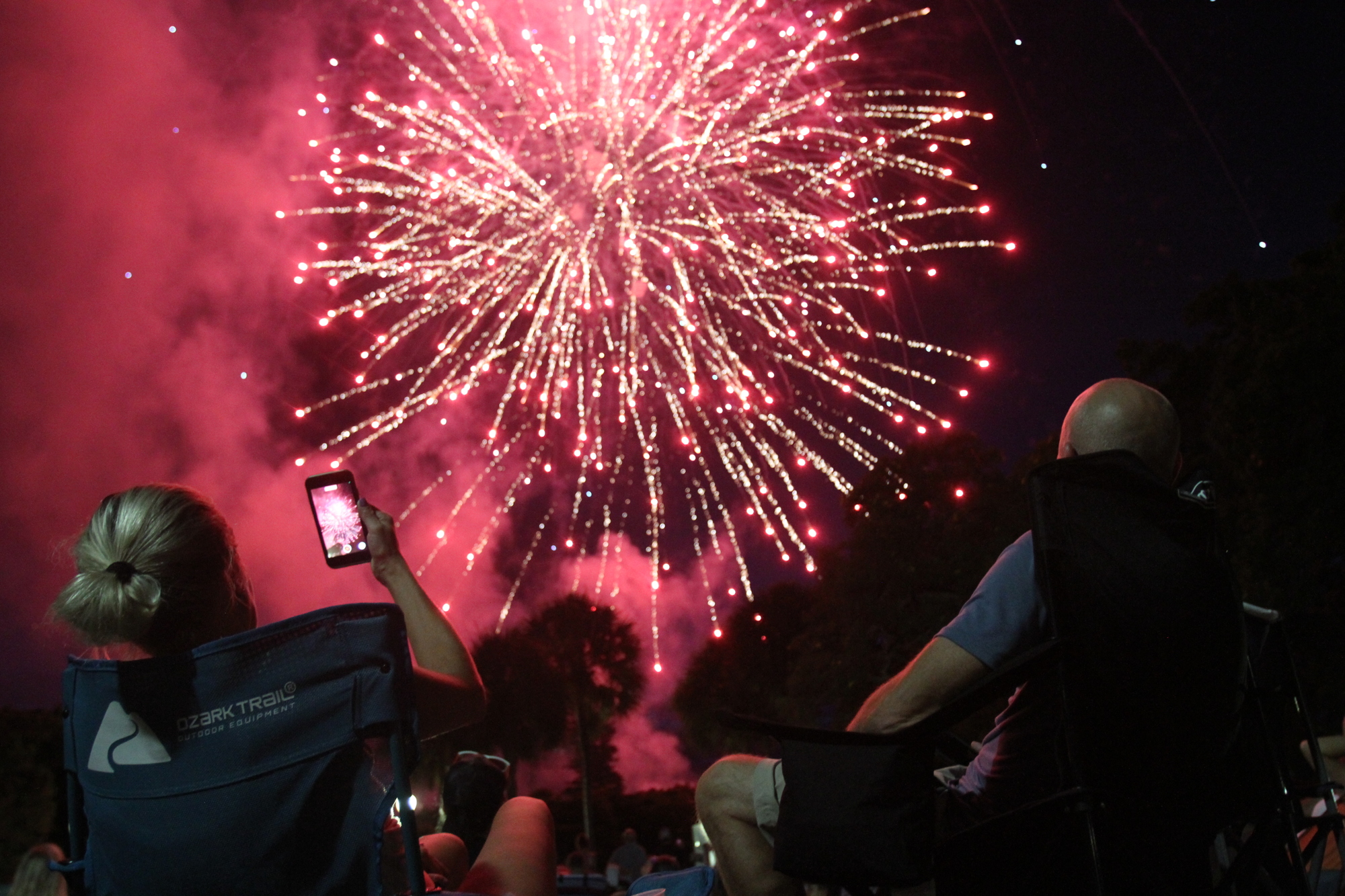 JULY: Visitors sit at Bayfront Park for the fireworks.