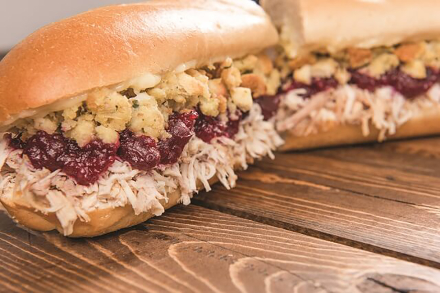 The Bobbie is a slow-roasted turkey sandwich topped with cranberry sauce, handmade stuffing and mayo on a soft roll.