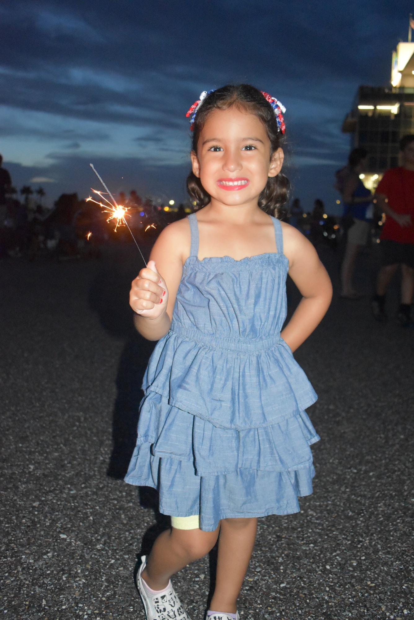 Sarasota's Abriana Navarro, 4, plays with a sparkler just minutes before the 2021 fireworks show began. (File photo)