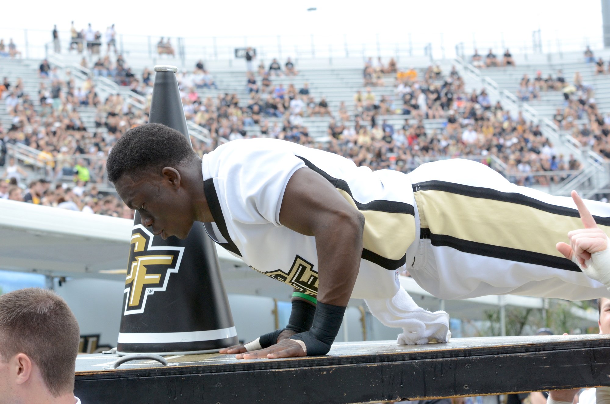Miterson Charles does push-ups after a UCF touchdown against UConn Nov. 11.