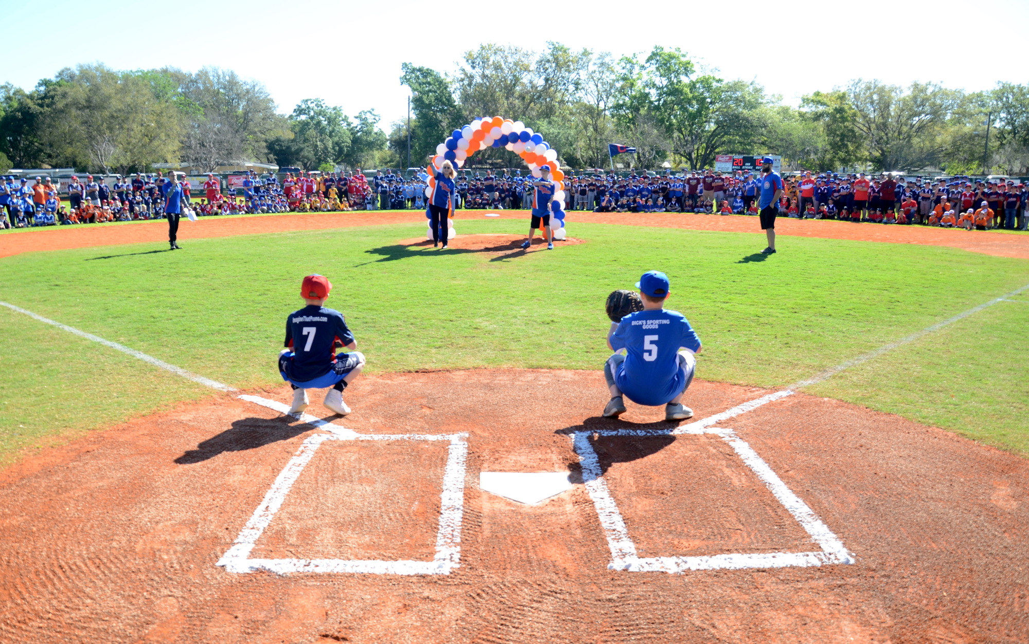 Debbie Dobbs and Breven Walker threw out the first pitch of the season for Winter Garden Little League.