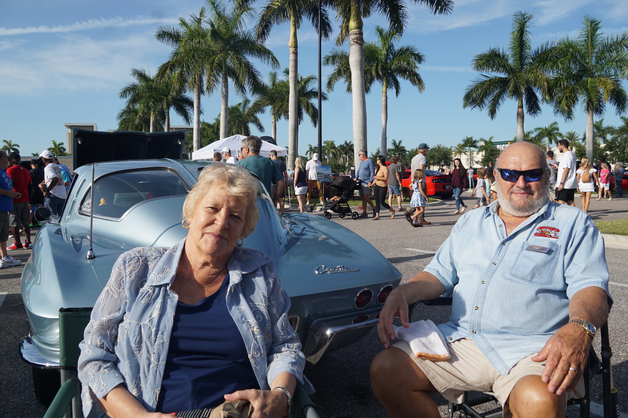 Nita and John Govoni sit with their 1963 Chevrolet Corvette.