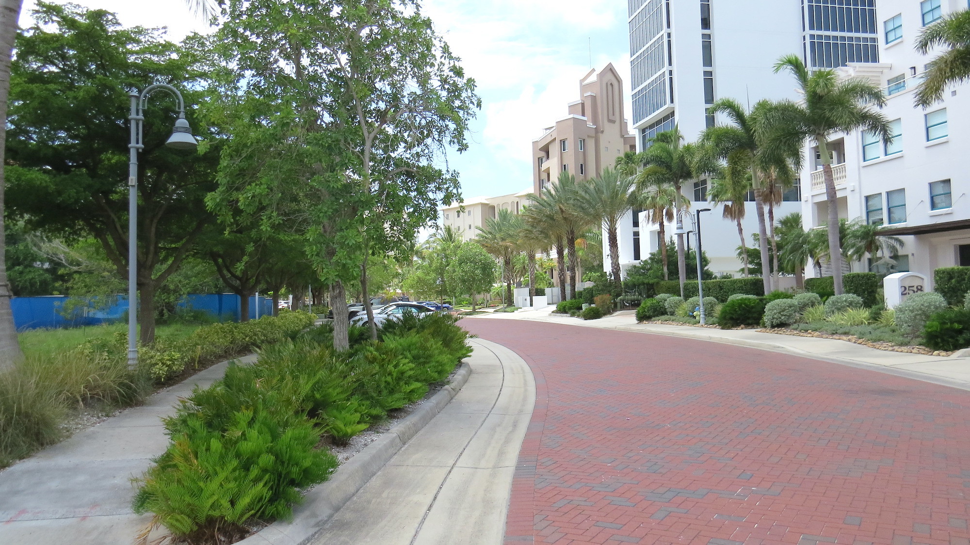 The 22-acre Golden Gate Point ellipse is a single paver street ringed with condominium towers along the perimeter. The planned Peninsula Sarasota site is to the left.