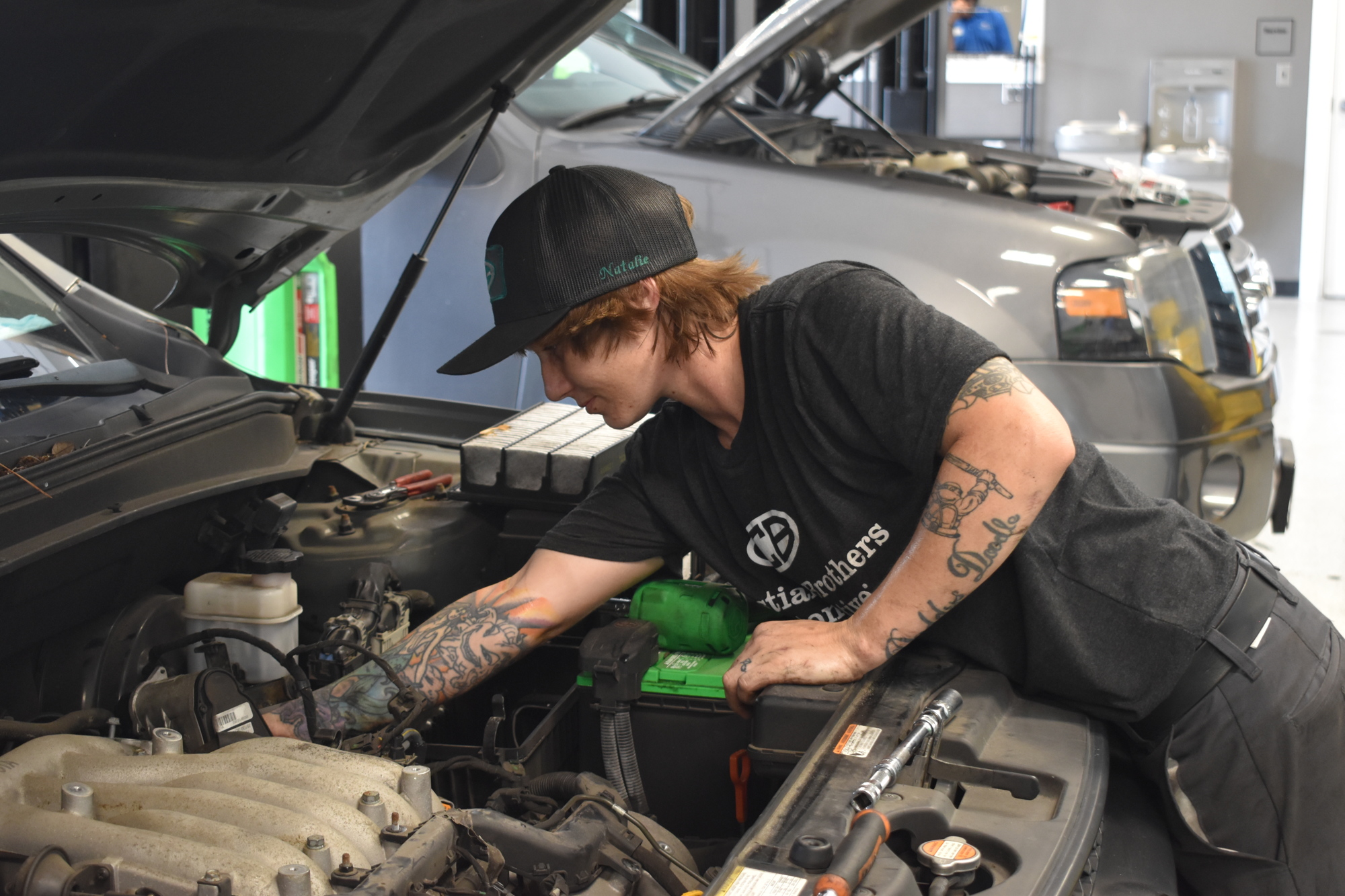 Natalie Turley services a car at Christian Brothers Automotive. (Photo by Ian Swaby)