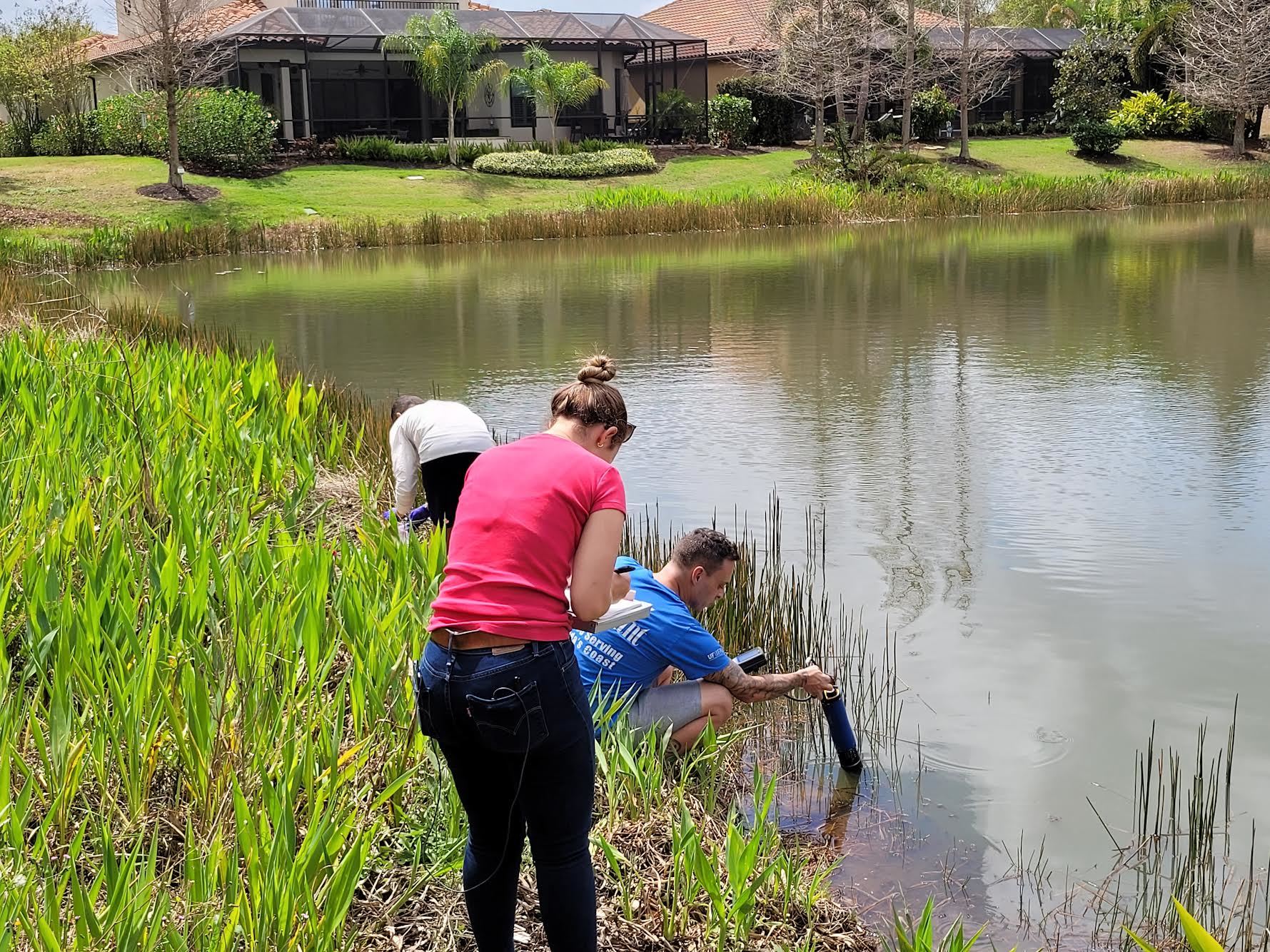 University of Florida researchers collect water samples from a Lakewood Ranch pond. (Courtesy photo)