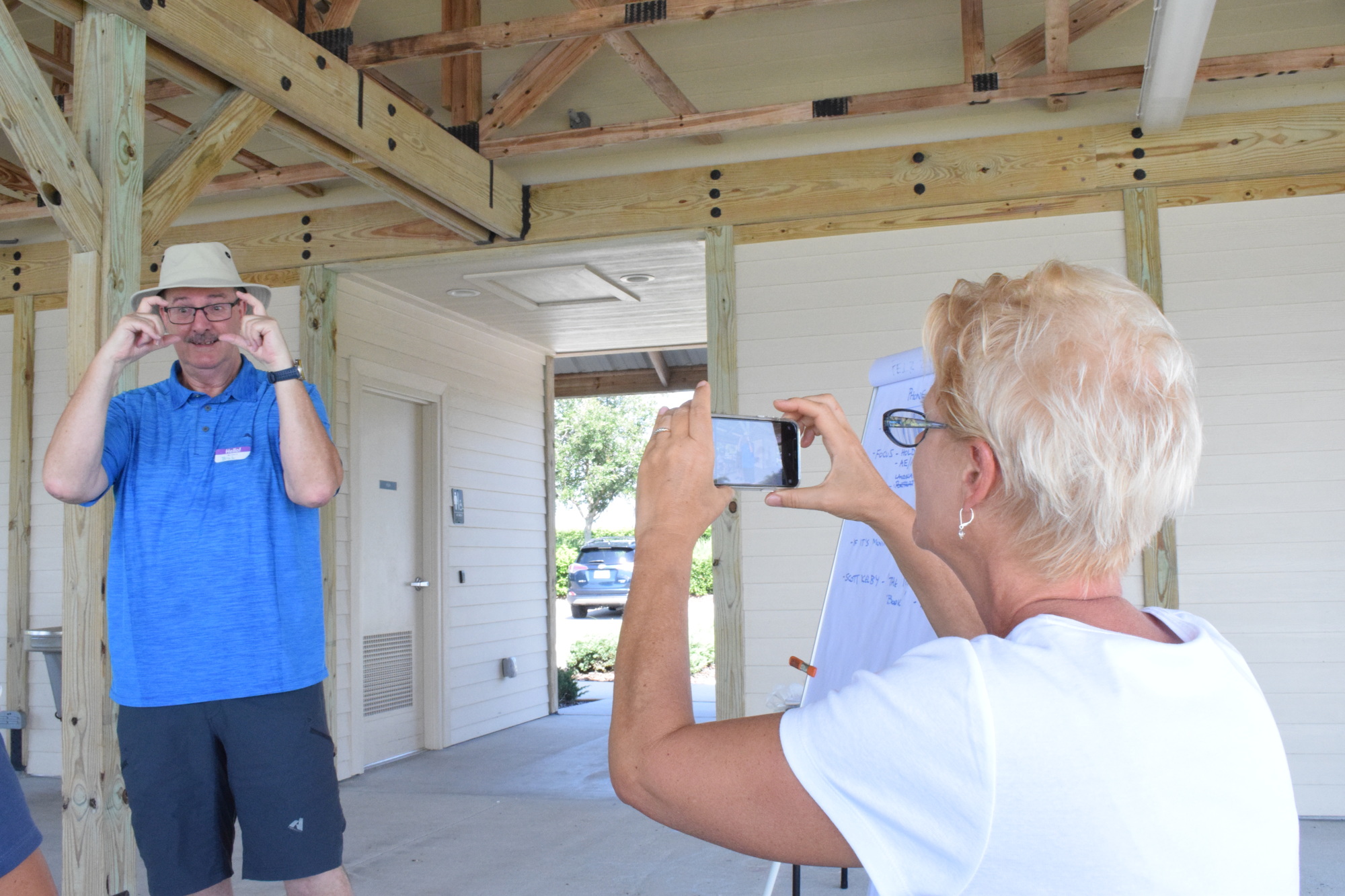 Lakewood Ranch's Bill Mills tells Lakewood Ranch's Mary Denz and other Intro to Phone Photography participants to sometimes take photos with their phones horizontal.