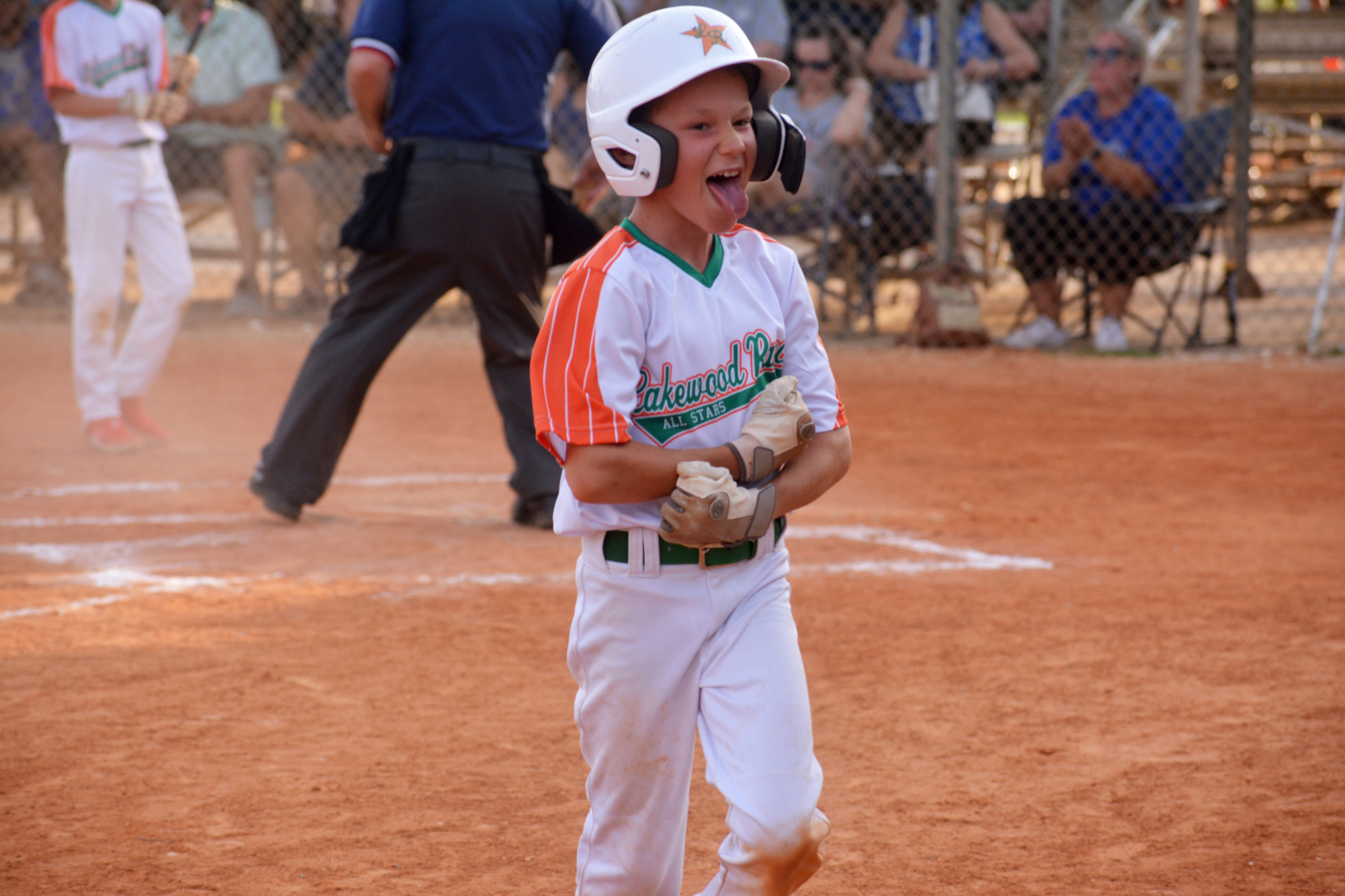 Cruz Desmond is fired up after sliding into home plate for a run in the Lakewood Ranch Little League 8-9-10 All-Star team's game against Buffalo Creek June 22. Lakewood Ranch defeated Buffalo Creek 13-3.