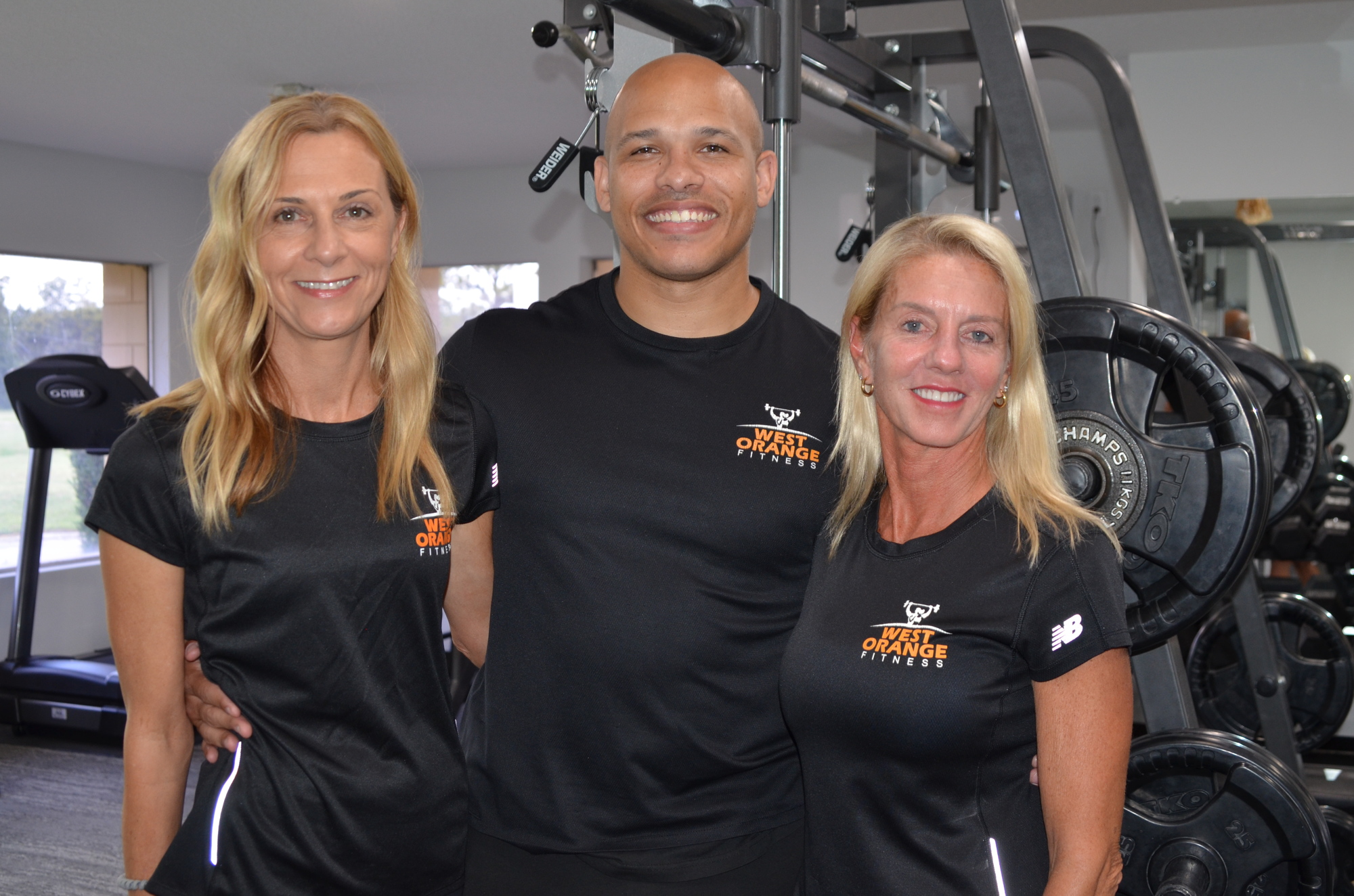 West Orange Fitness owner Gina Denison, right, with Penny Dittbrenner and Brandon Strong, offer personal training at her new gym at the West Orange Country Club.