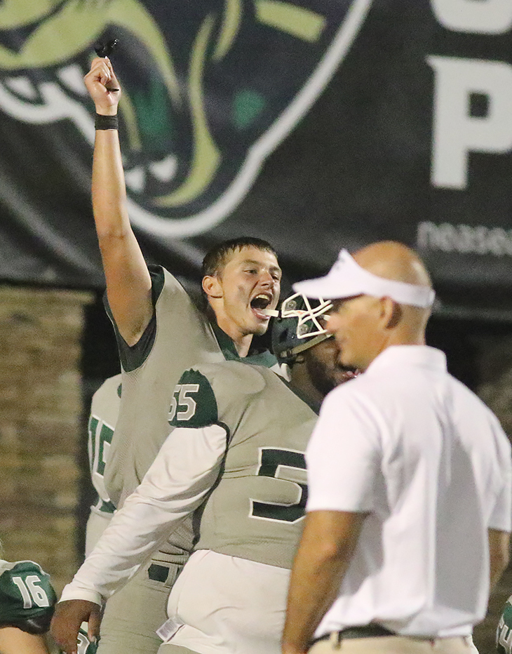 Ashton Bracewell, rear, celebrates a victory in the Kickoff Classic last season. File photo by Christine Rodenbaugh