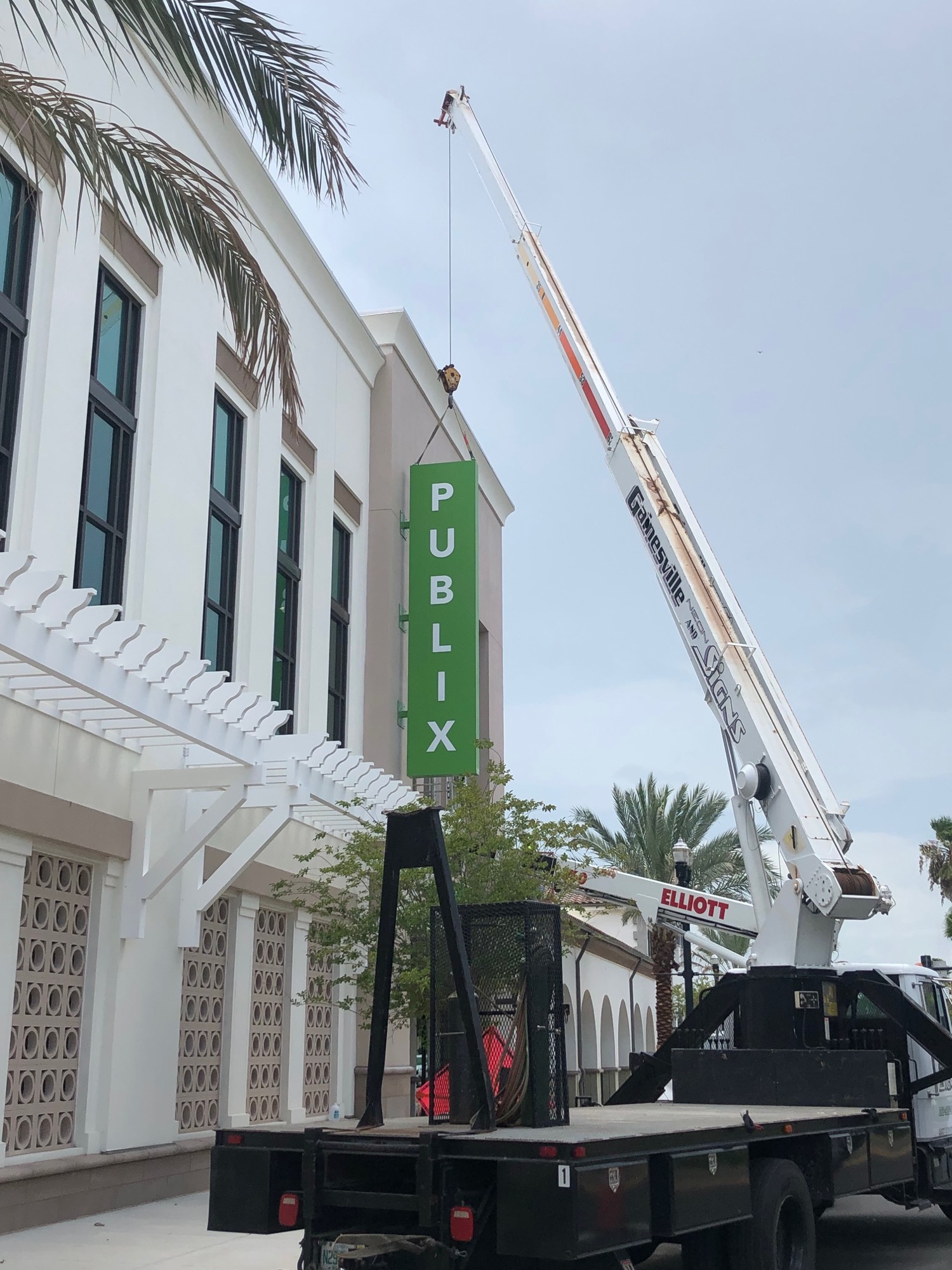 The sign goes up on the rear of the store.