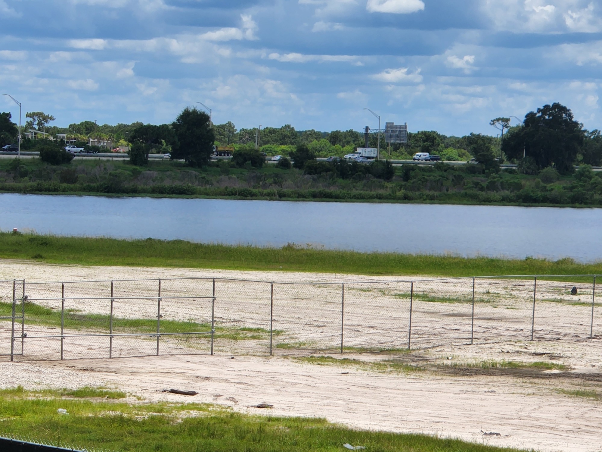 The fence line of the construction site of the new Mote SEA stands only a few hundred yards from I-75. (Photo by Andrew Warfield)