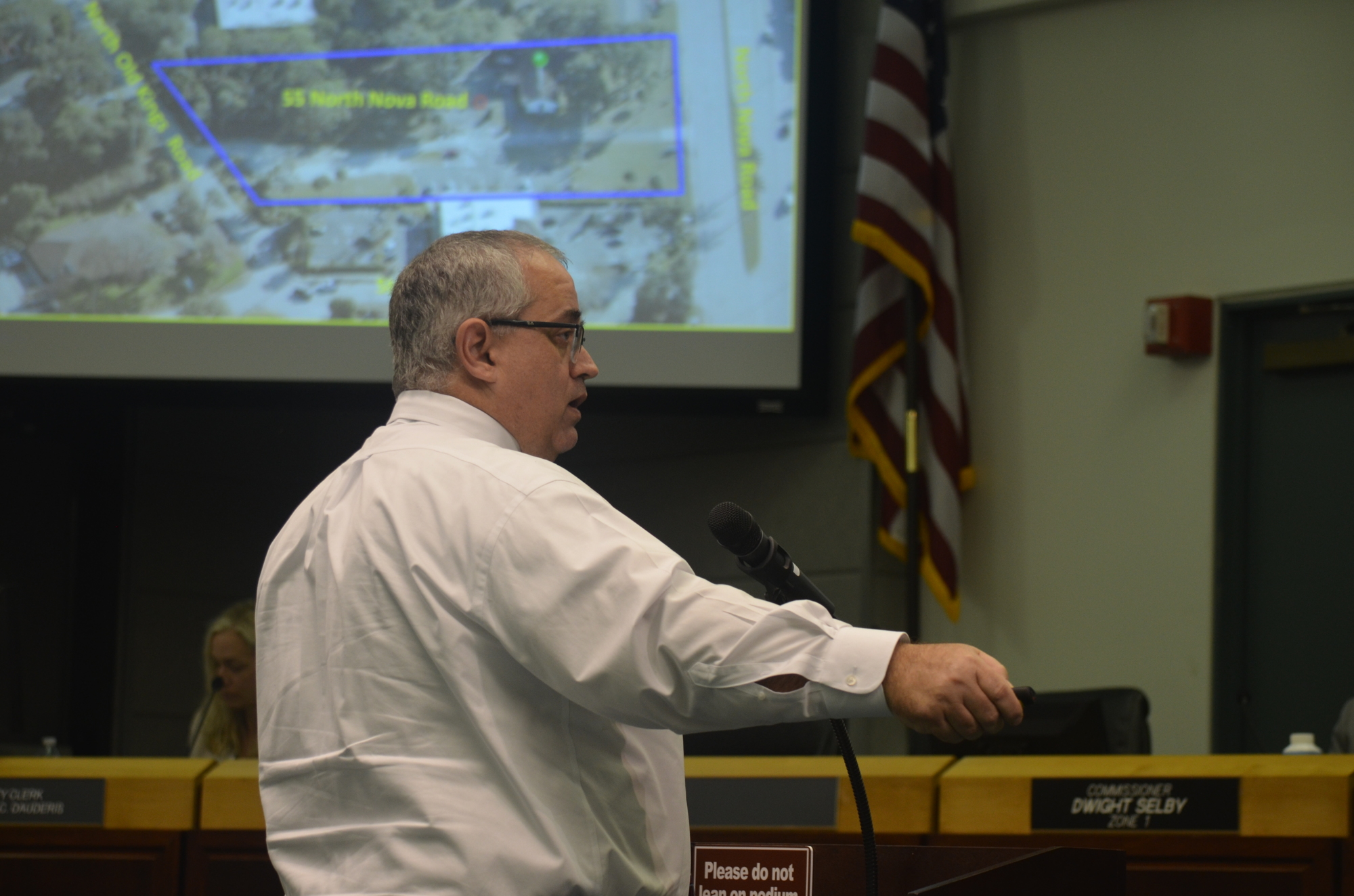 Planning Director Steven Spraker speaks about plans for new car wash during the July 19 City Commission meeting. Photo by Mia Striegel