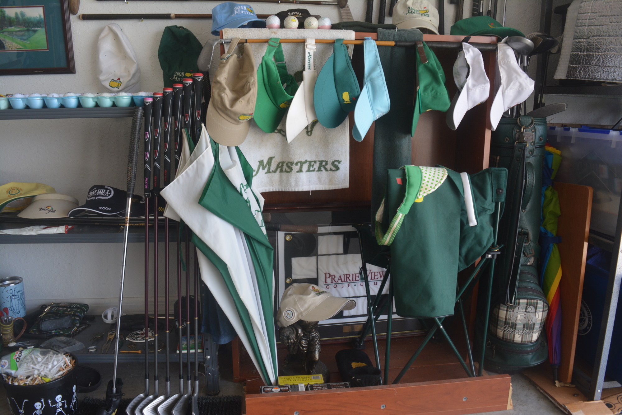 The Masters portion of Keith Heifner's golf collection contains hats, flags and other memorabilia. (Photo by Ryan Kohn)