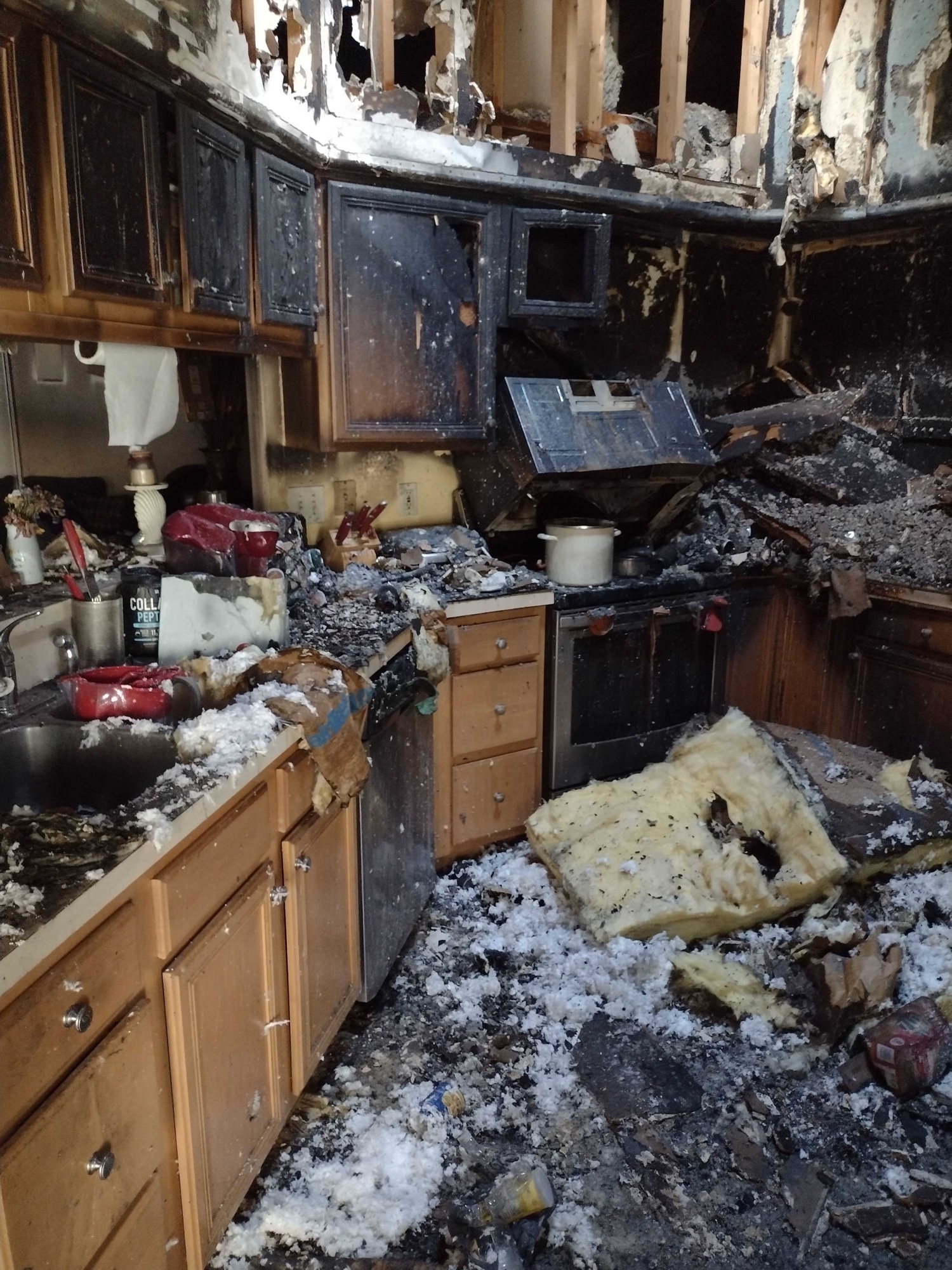The house fire originated in the kitchen and spread to the living room.