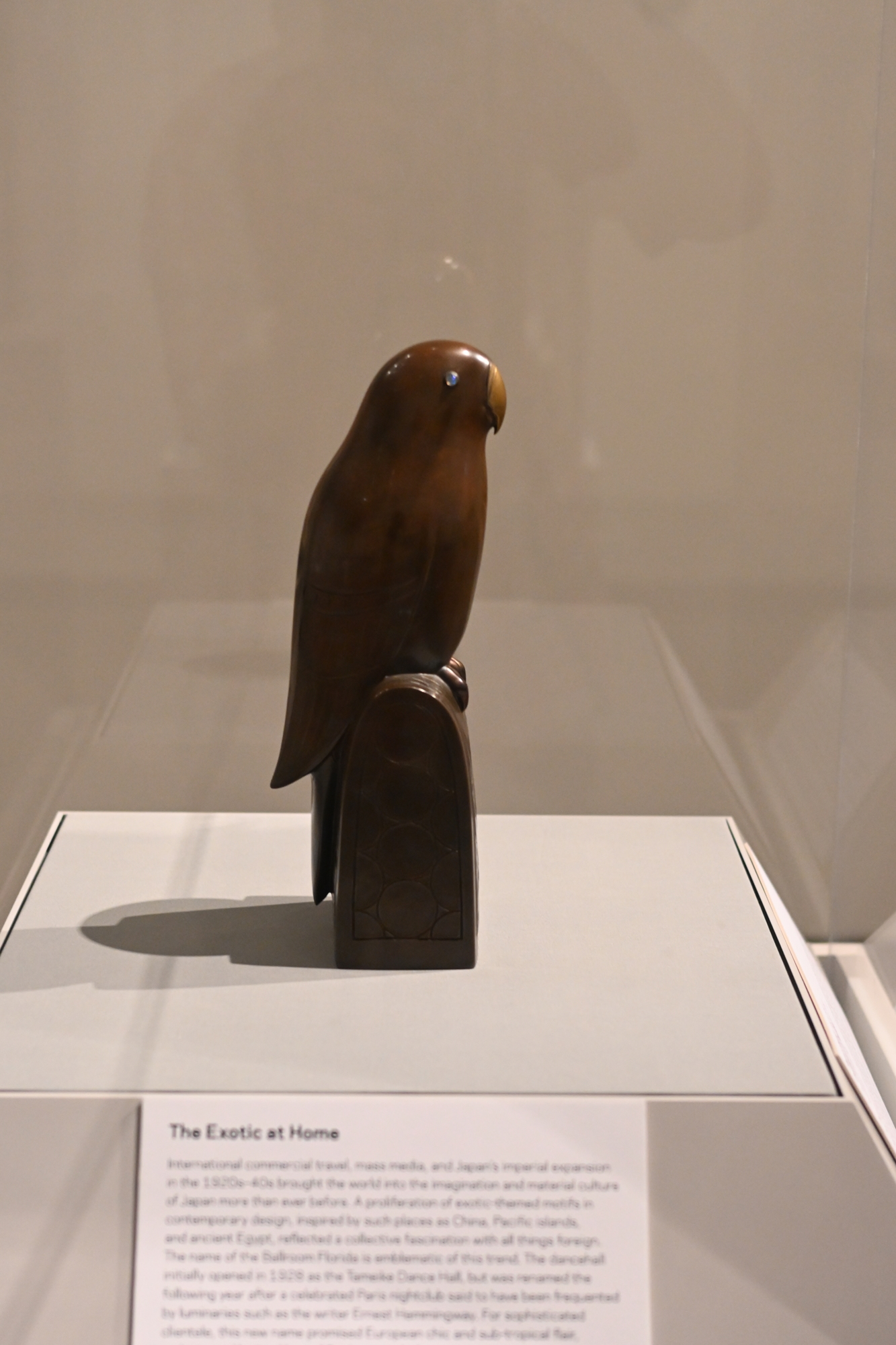 The exhibit also includes home furnishings such as this bronze parrot with opal eyes. (Photo by Spencer Fordin)