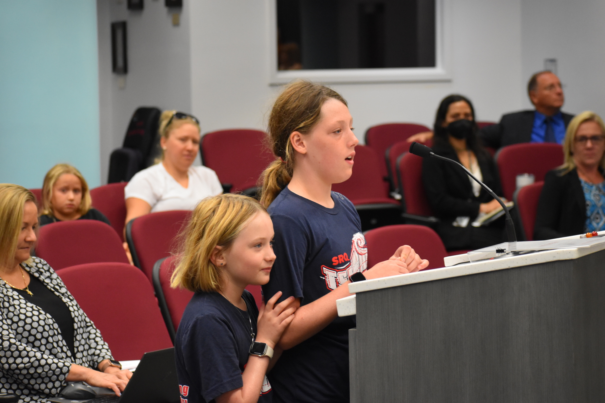 Maggie Mooney's daughters, 8-year-old Tegan Portale and 11-year-old Payton Portale, speak at the commission meeting on July 28. (Photo by Ian Swaby)
