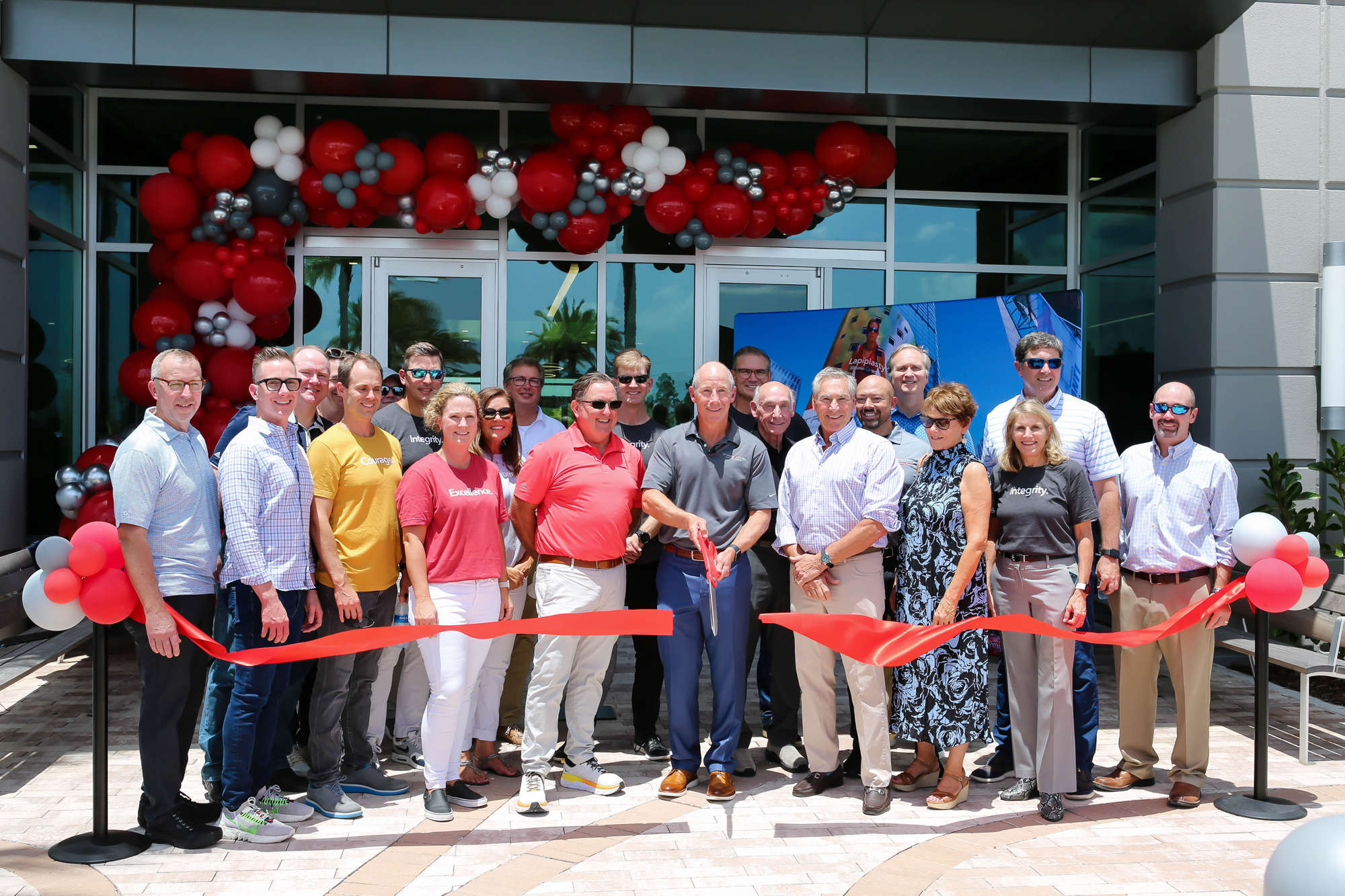 Treace Medical Concepts founder and CEO John Treace cuts the ribbon at the company's new headquarters. (becphotography)