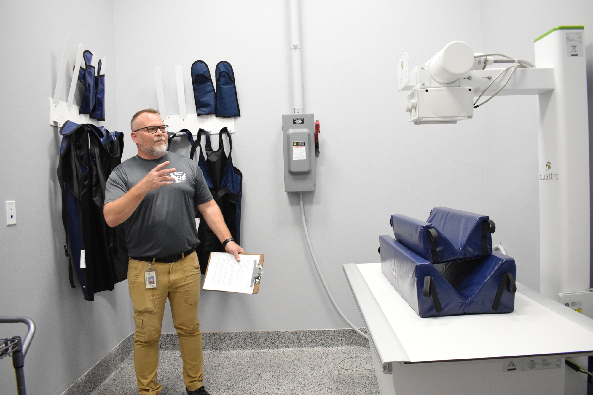 Hans Wohlgefahrt, the outreach specialist for Manatee County Animal Welfare, says the X-ray will help the shelter ensure animals will be taken care of as soon as they enter the shelter. (Photo by Liz Ramos)