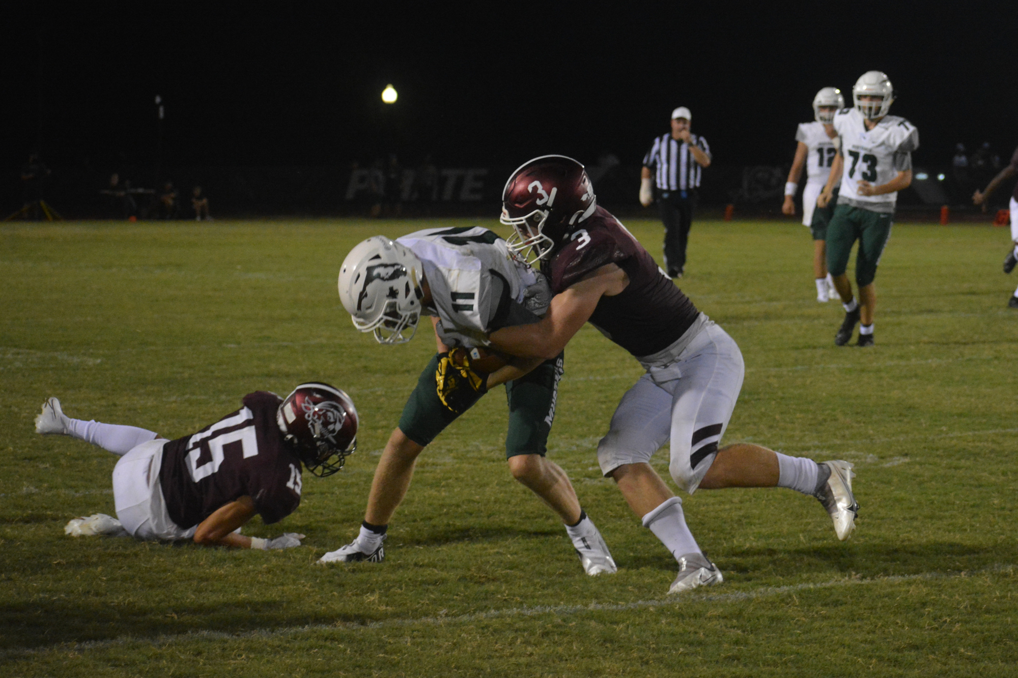 Braden River linebacker Aidan Dangler (right) puts a hit on Lakewood Ranch wide receiver Isaac Ashley during the teams' 2021 rivalry game. Dangler led the Pirates with 123 tackles last season. (File photo)