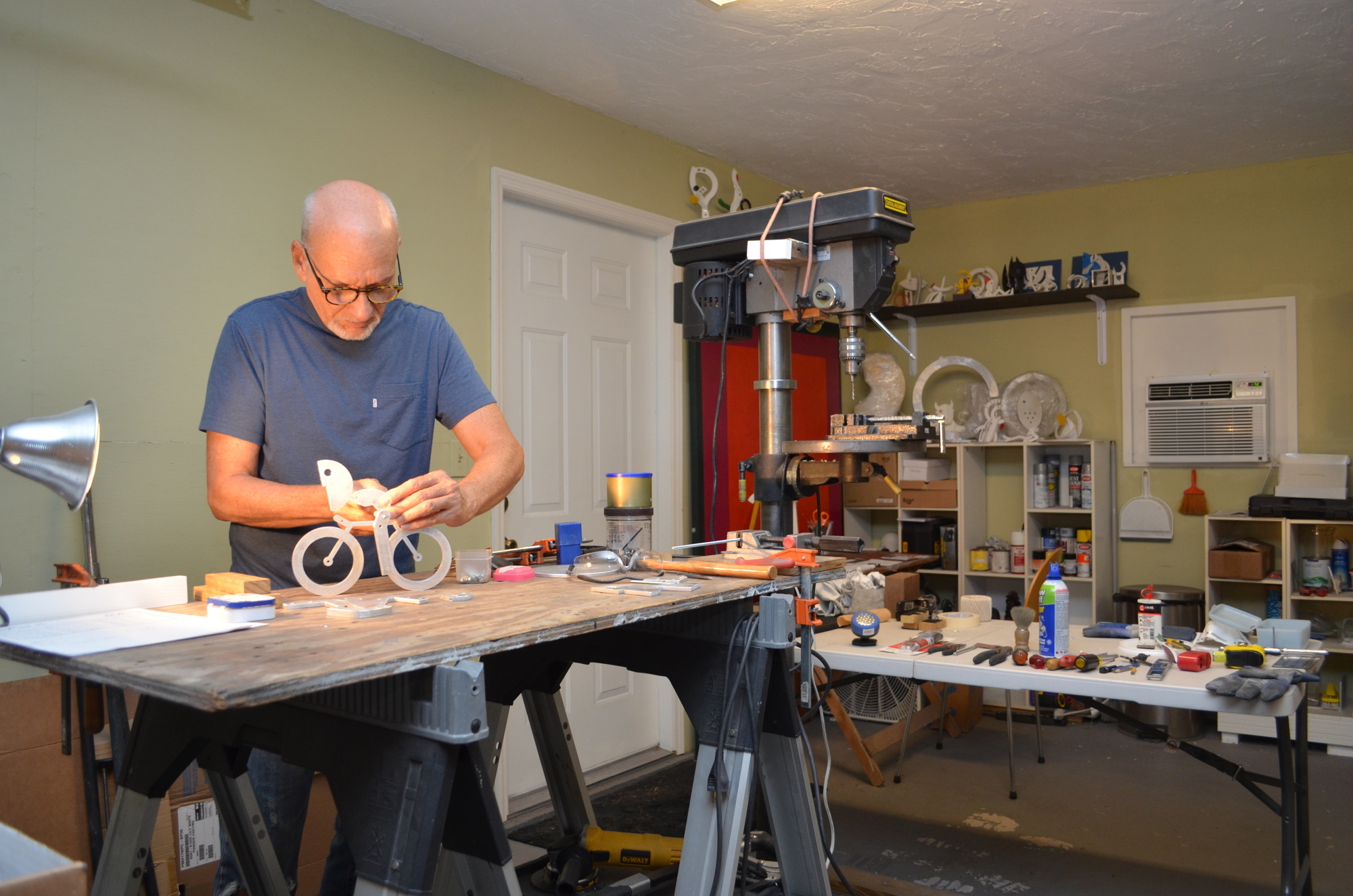 Although the bright colors and slices of everyday life might seem cheerful and care-free, when sculptor Jorge Blanco is in his home studio workshop, it’s all about one thing: serious sculpture. (File photo)